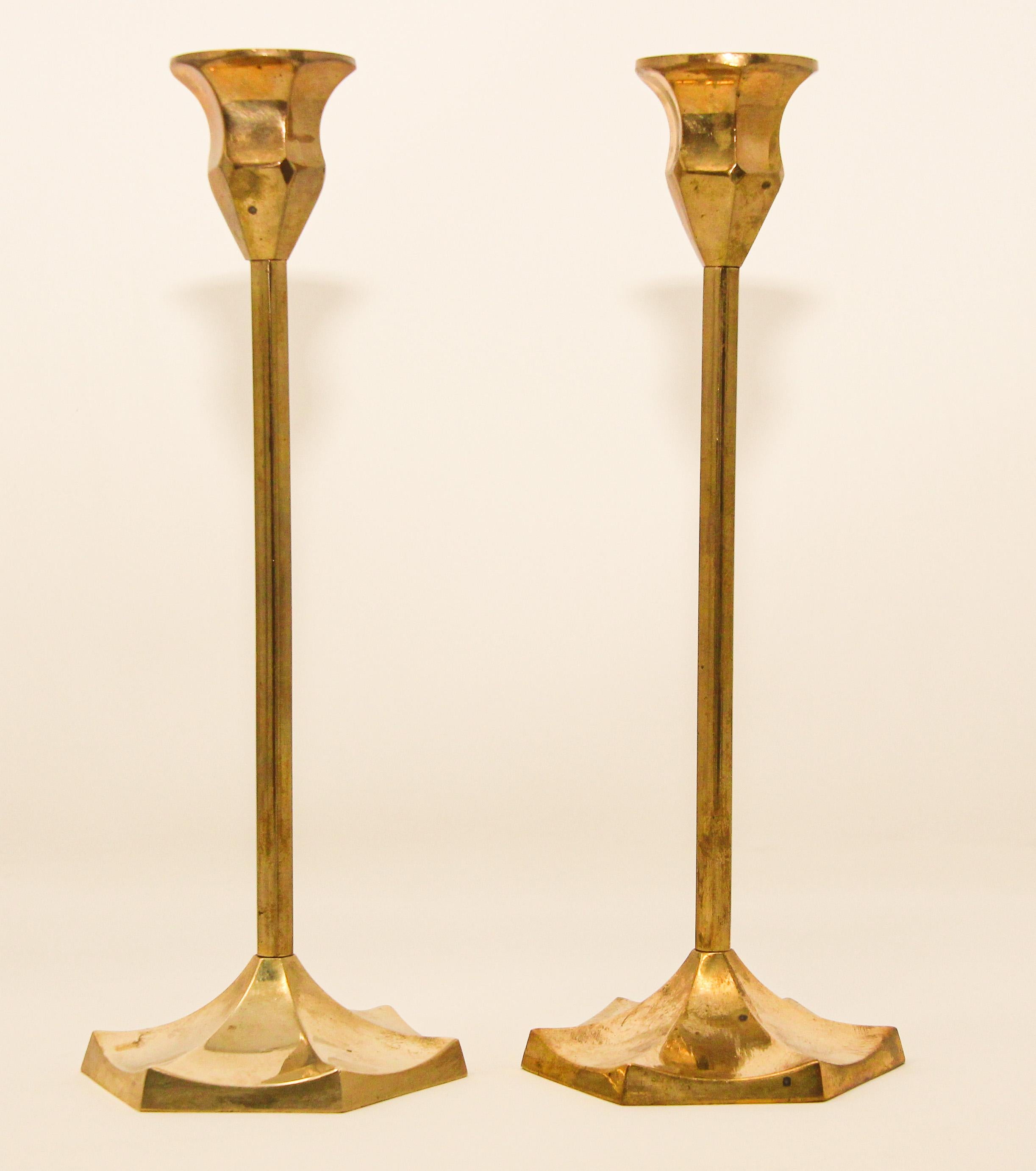 Pair of brass polished candlesticks with a molded hexagonal base.
Pair of Swedish 20th century hand-tooled brass candlesticks.
Handcrafted cast brass candle sticks, candle holders, finely hand tooled.
Height: 9