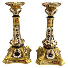Pair of Polychrome Old Imari Royal Crown Derby Porcelain Dolphin Candlesticks