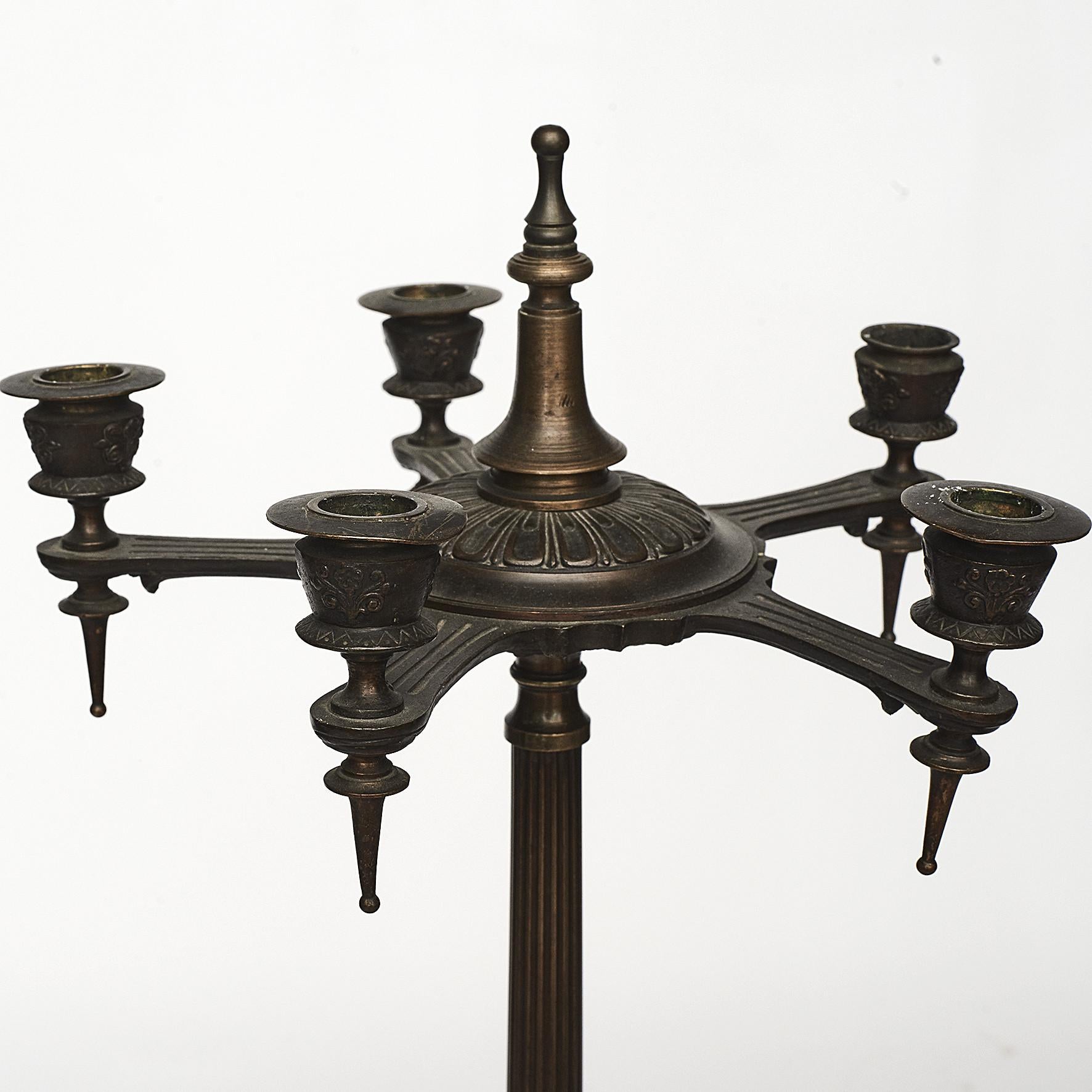 Pair of Italian Pompeian style candelabras crafted in patinated bronze.
Five candle arms with detachable bobeches.
Fluted column supported on a tripod base with animal's paws.
Italy Mid-19th Century.
Sold as a pair.