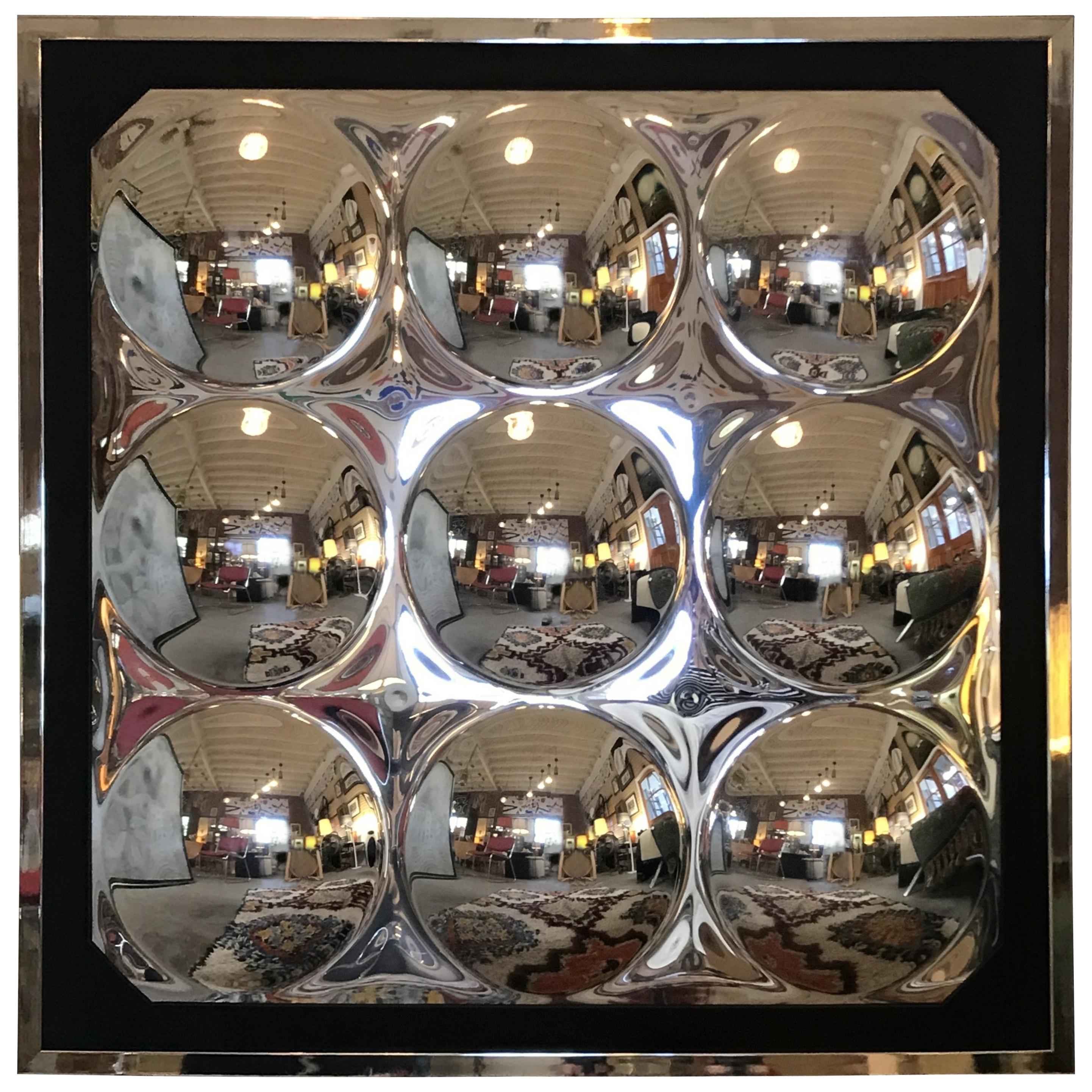 A pair engaging mirrored wall hanging made of nine convex circles arranged in a grid. They sit in chromed frames.
They can be sold separately.