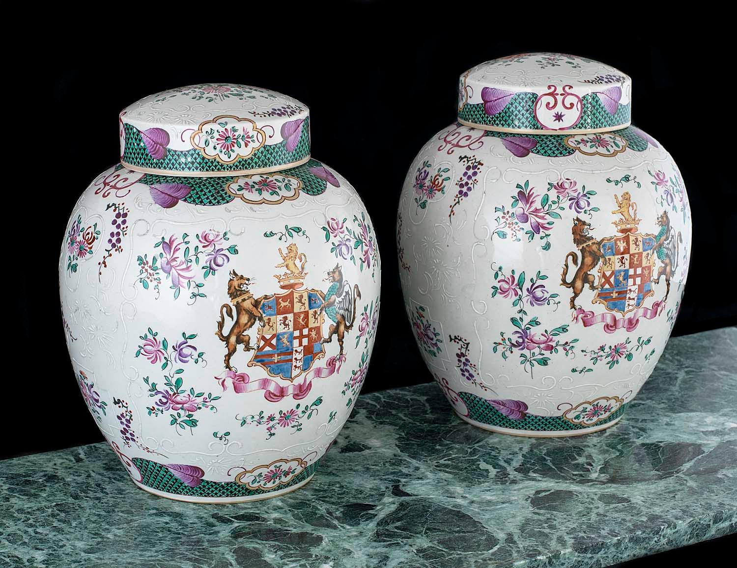 A large and fine pair of porcelain armorial lidded vases with meticulously hand painted molded and enamelled family crests and foliate decoration made by Edmé Samson (b Paris, 1810; d Paris, 1891), and were probably intended to be used as ginger