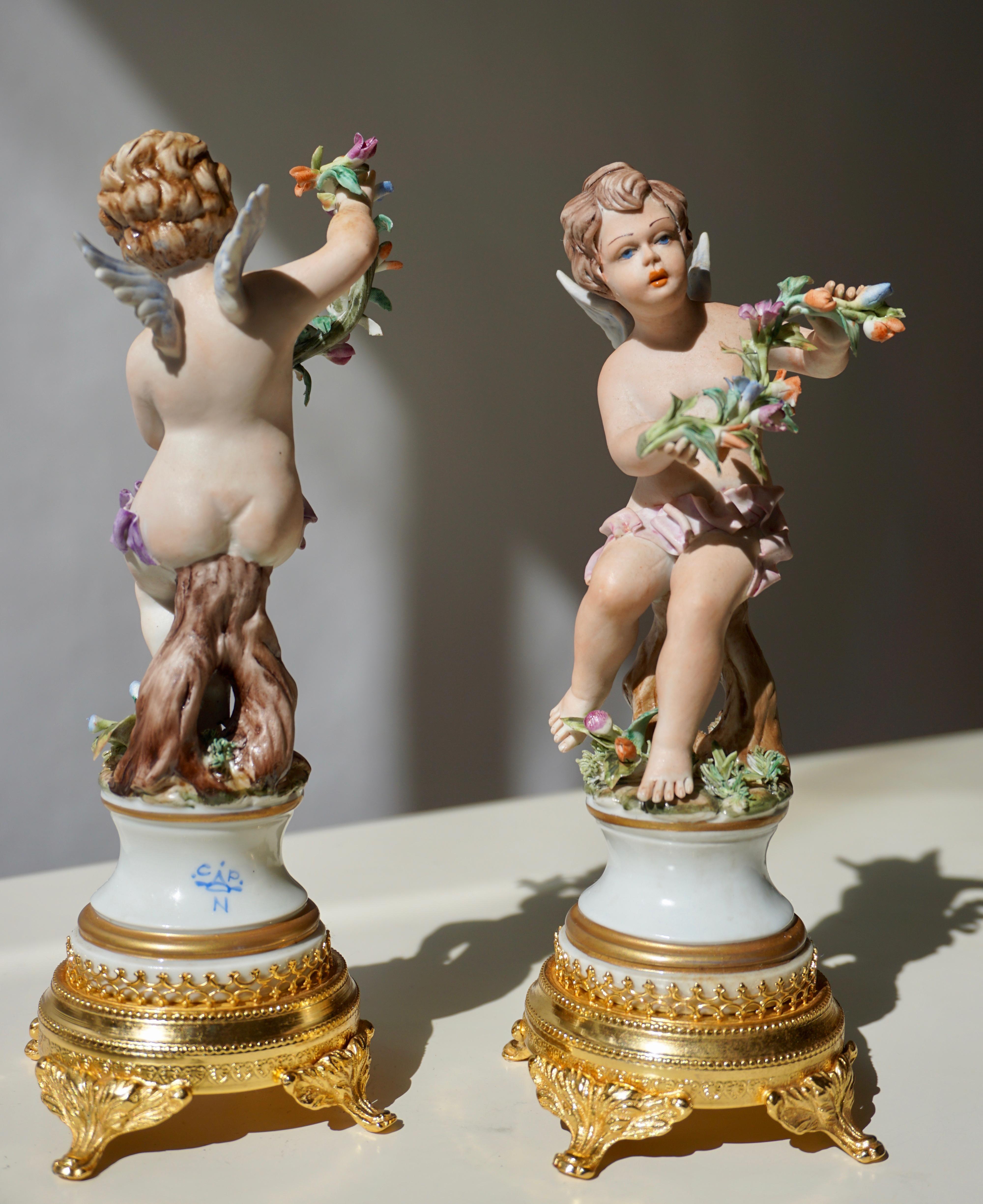 Mid-Century Modern Pair of Porcelain Capodimonte Cherubs 20th Century Polychrome Putti Figures