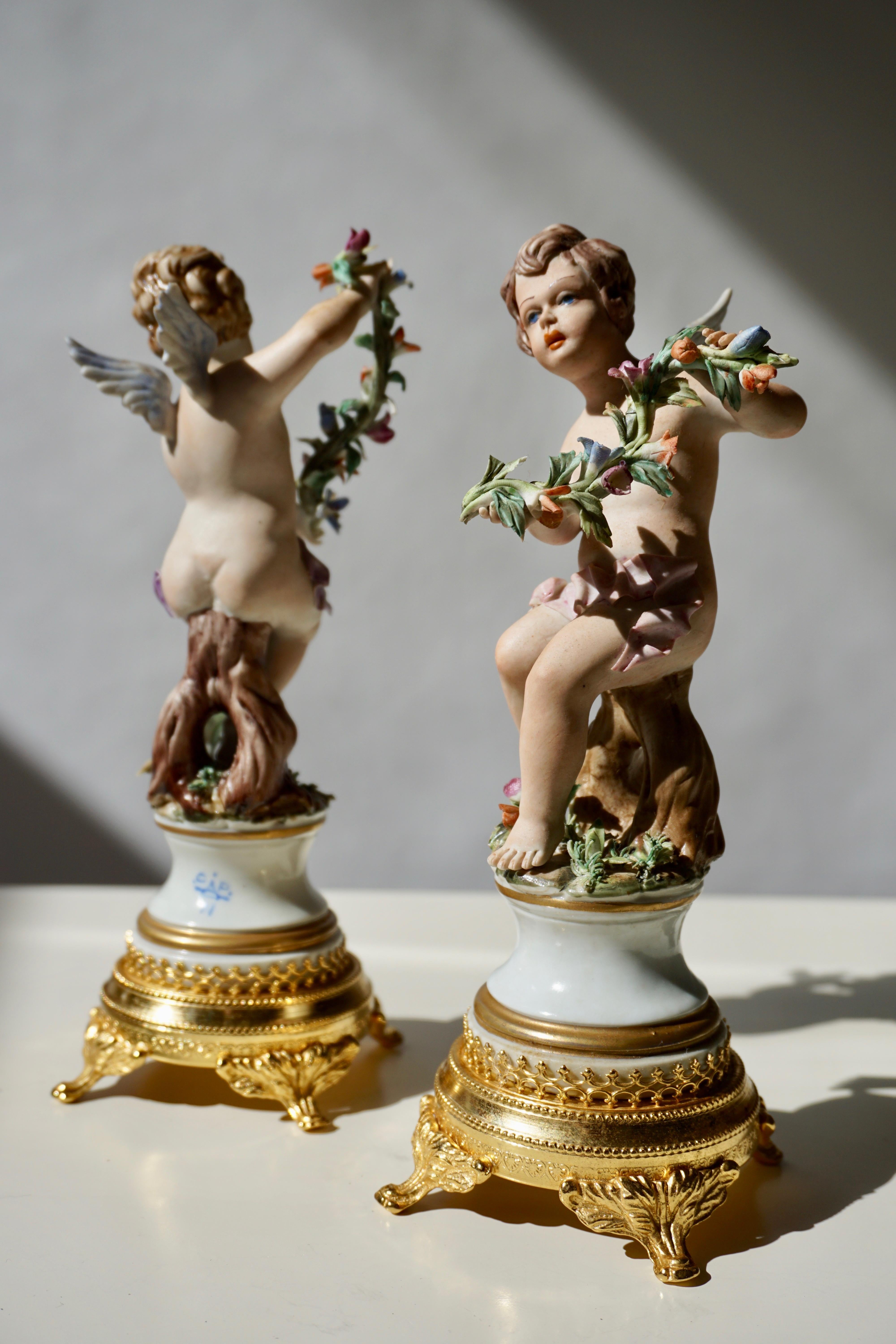 Italian Pair of Porcelain Capodimonte Cherubs 20th Century Polychrome Putti Figures