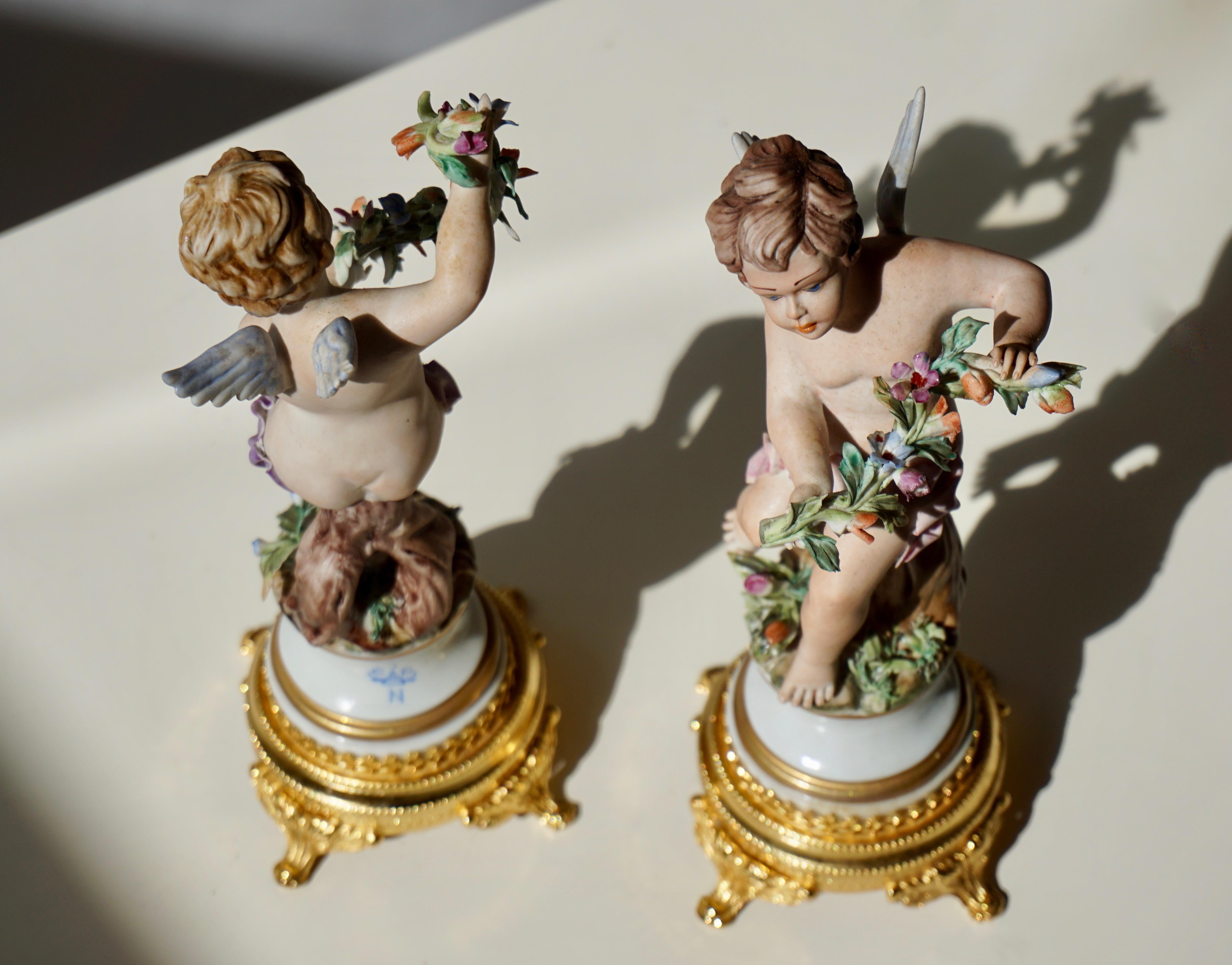 Brass Pair of Porcelain Capodimonte Cherubs 20th Century Polychrome Putti Figures