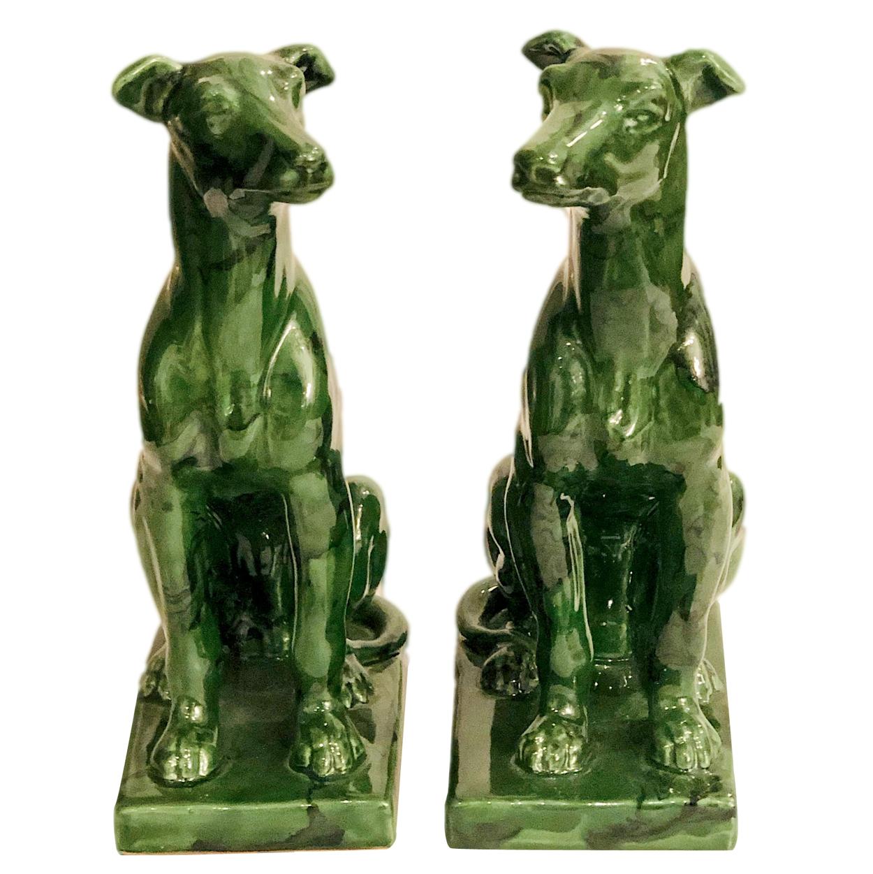 A pair of circa 1930's English green porcelain Whippet dogs.

Measurements:
Height: 11