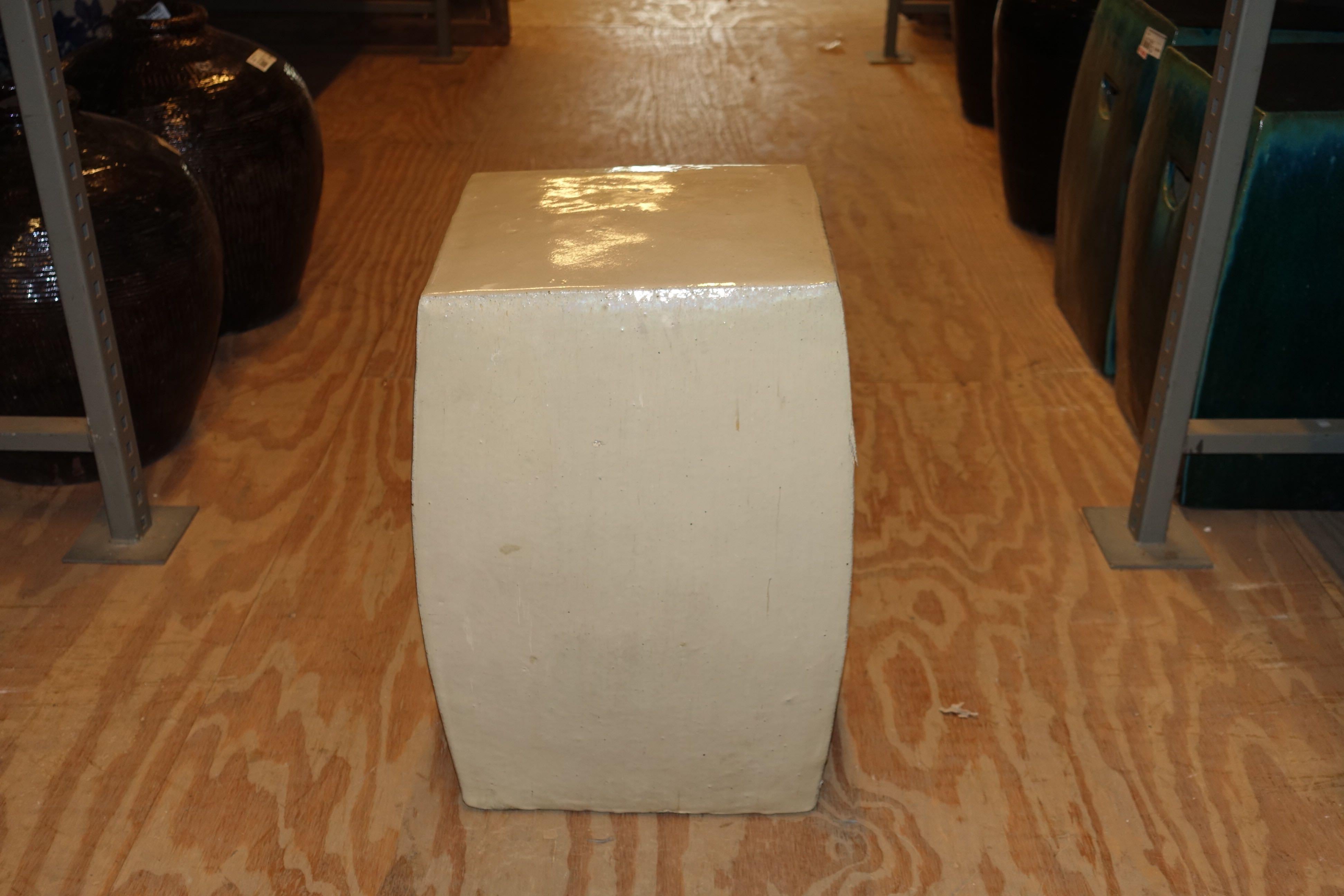 Cream colored glazed pair of square terra cotta garden stools.
Recessed handles for easy movement.
Sturdy and very durable.
Centre measures 14.25