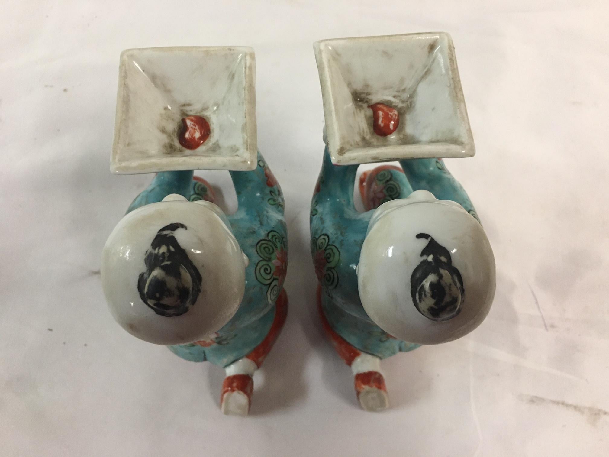 Pair of Porcelain Kneeling Chinese Boys Holding Shallow Single Blossom Vessels For Sale 5