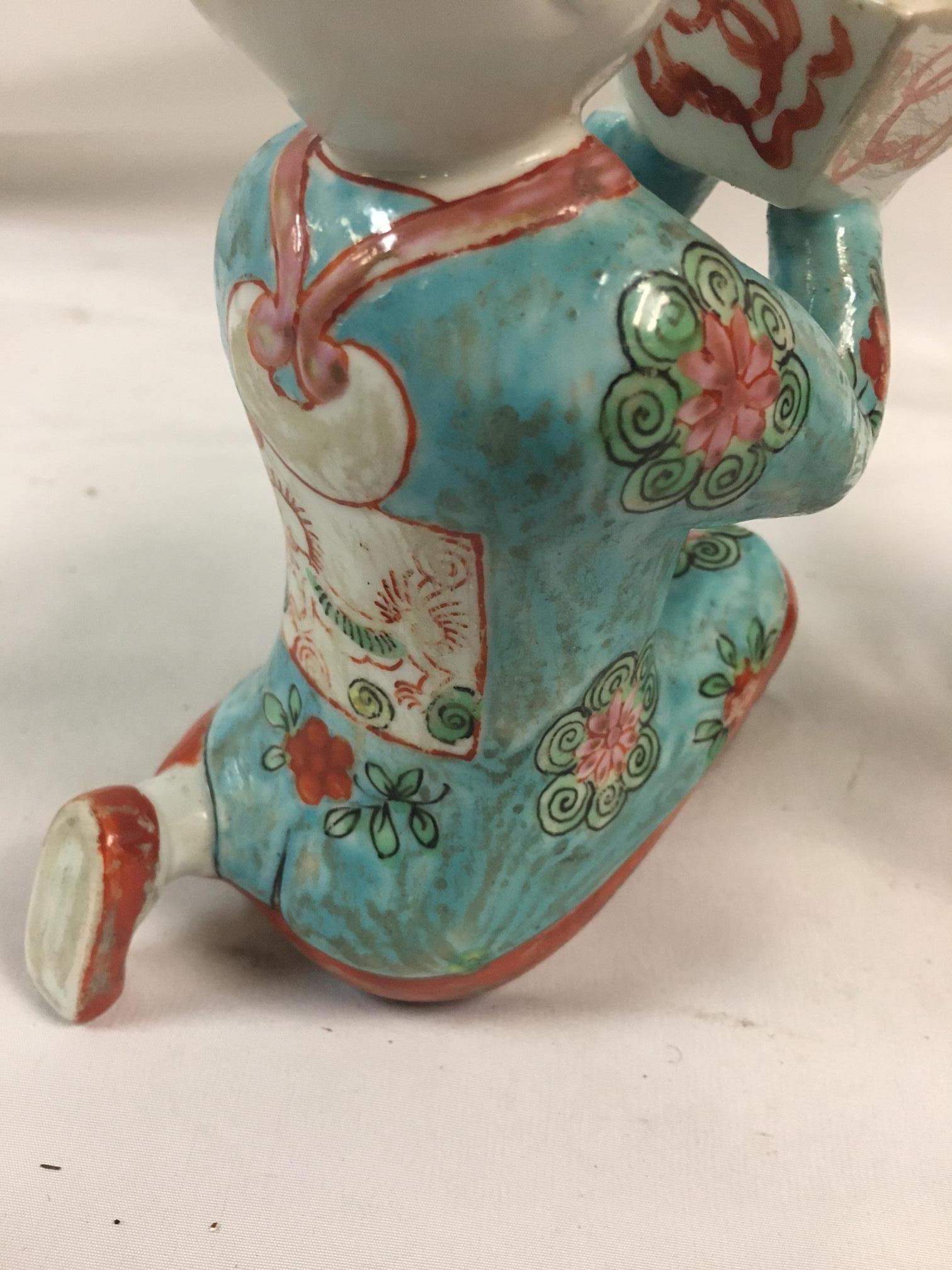 Pair of Porcelain Kneeling Chinese Boys Holding Shallow Single Blossom Vessels For Sale 7