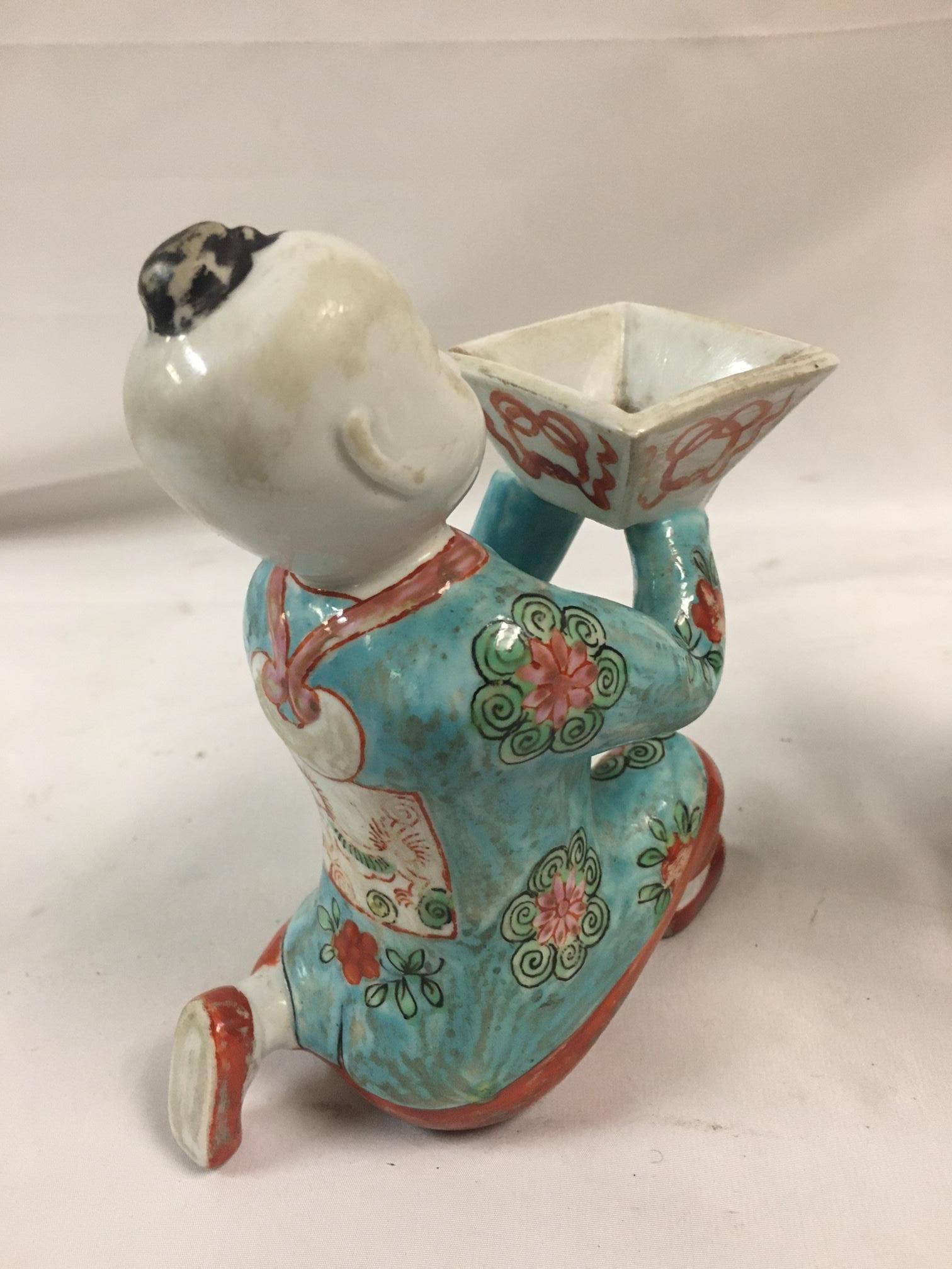 Pair of Porcelain Kneeling Chinese Boys Holding Shallow Single Blossom Vessels For Sale 9