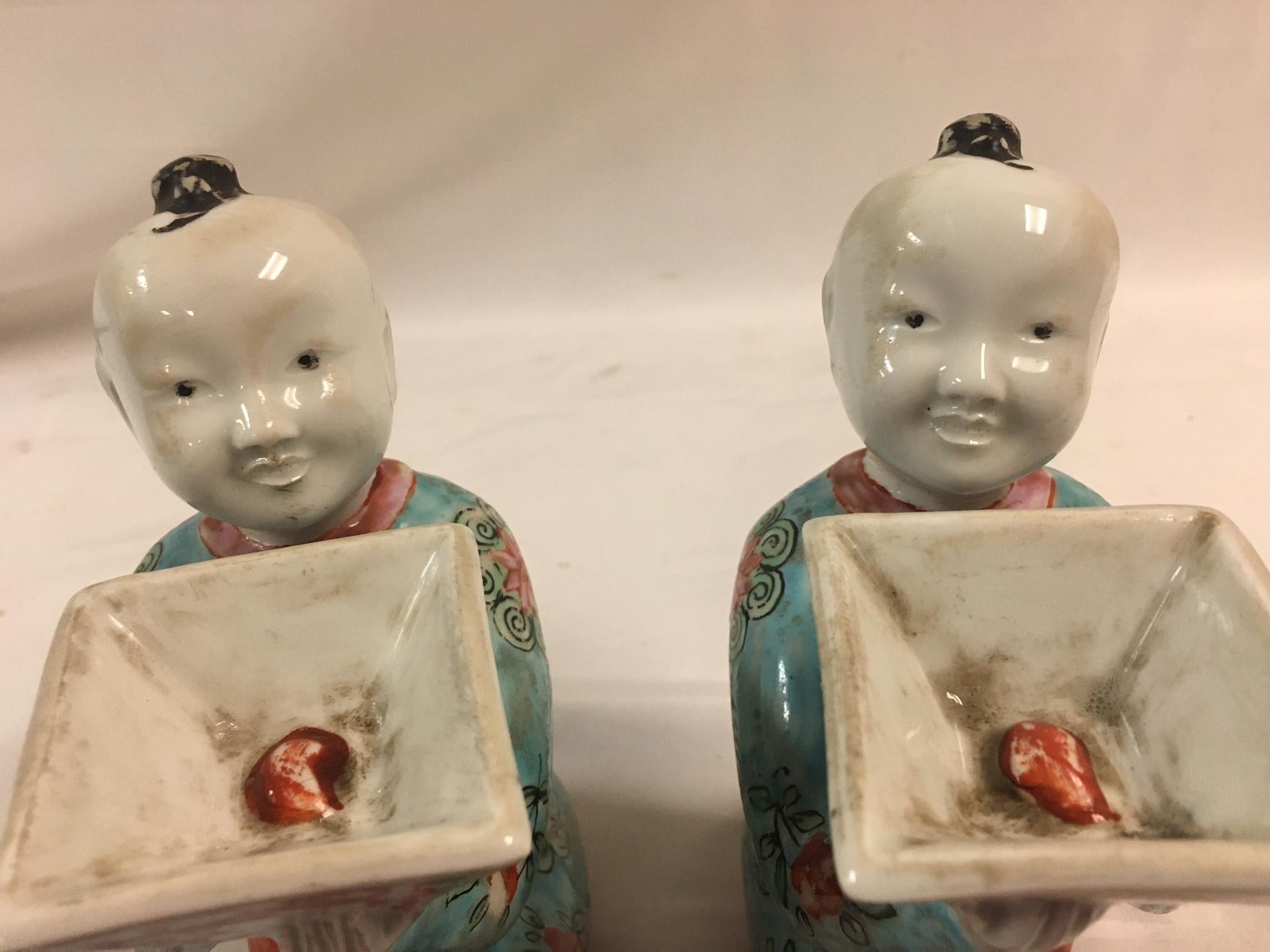 Pair of Porcelain Kneeling Chinese Boys Holding Shallow Single Blossom Vessels For Sale 2