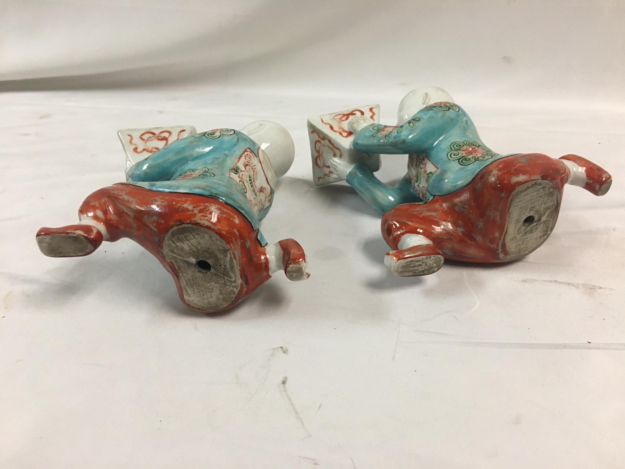 Pair of Porcelain Kneeling Chinese Boys Holding Shallow Single Blossom Vessels For Sale 3