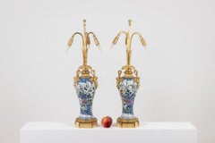 Pair of porcelain lamps decorated with bronze satyrs. Circa 1880.