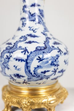 Pair of porcelain lamps decorated with dragons, gilt bronze. Circa 1880
