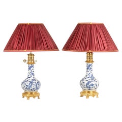 Pair of porcelain lamps decorated with dragons, gilt bronze. Circa 1880