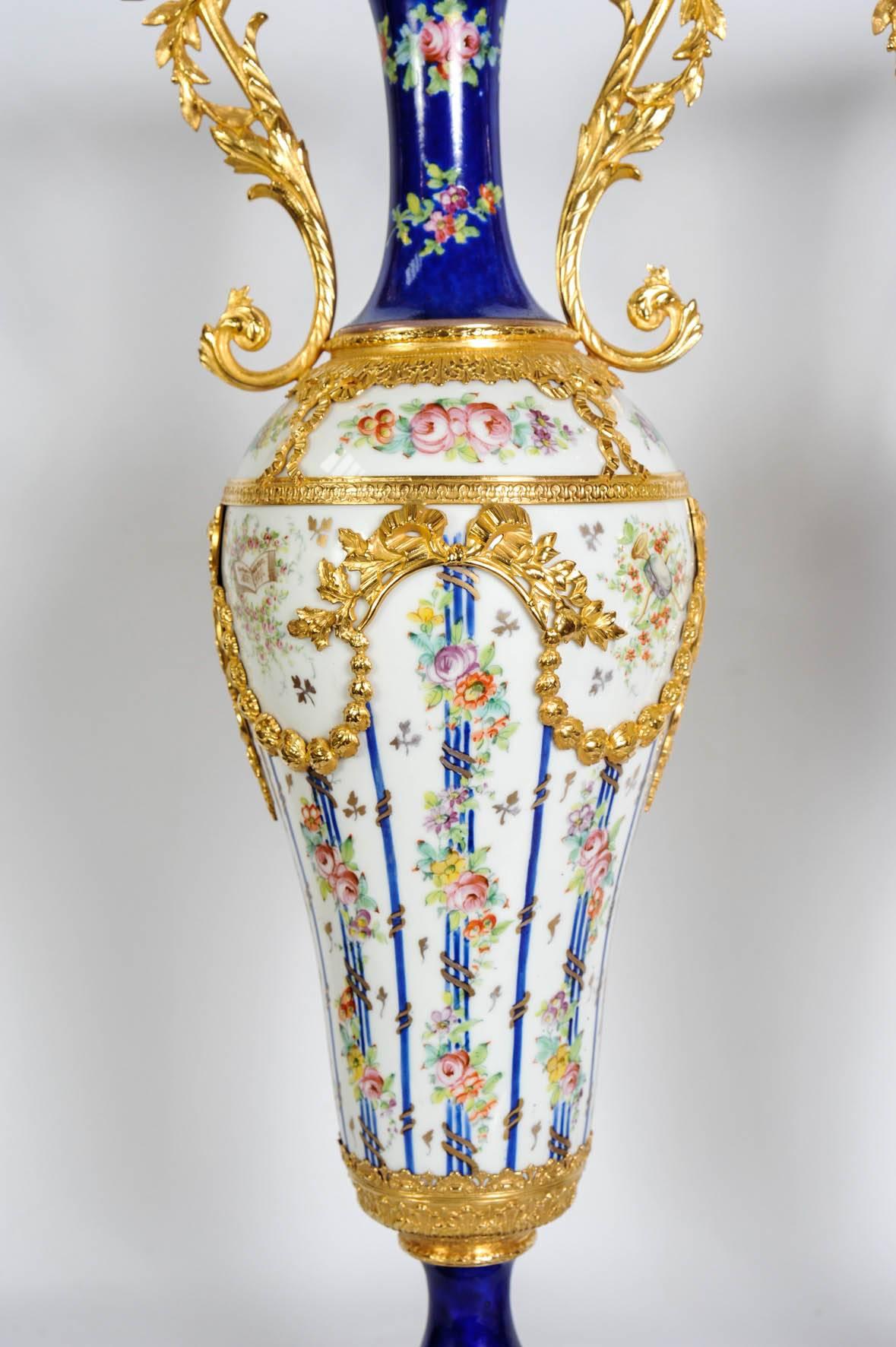 Elegant pair of vases, Porcelain of Sèvres ornamented with gilded bronzes.