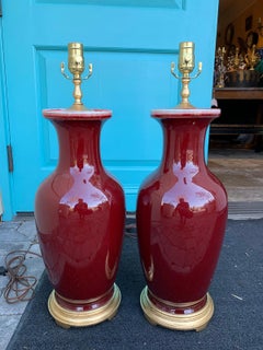 Pair of Porcelain Oxblood 'Sang de Boeuf' Lamps, circa 1920s-1940s