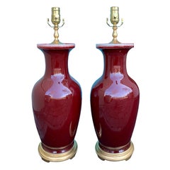 Pair of Porcelain Oxblood 'Sang de Boeuf' Lamps, circa 1920s-1940s
