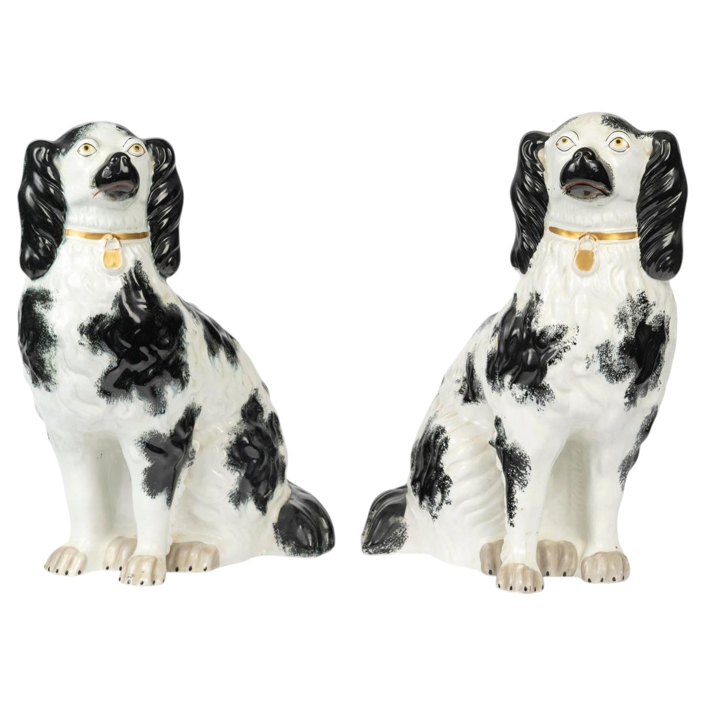 Pair of Porcelain Sculpture Depicting King Charles Spaniels, 20th Century.