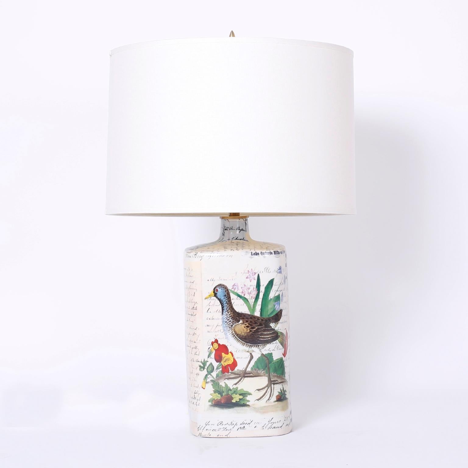 Pair of vintage porcelain table lamps decorated with a delightful decoupage technique depicting birds, flowers and a scholastic style script reminiscent of early ornithological engravings. Signed John
Derian on the bottoms.