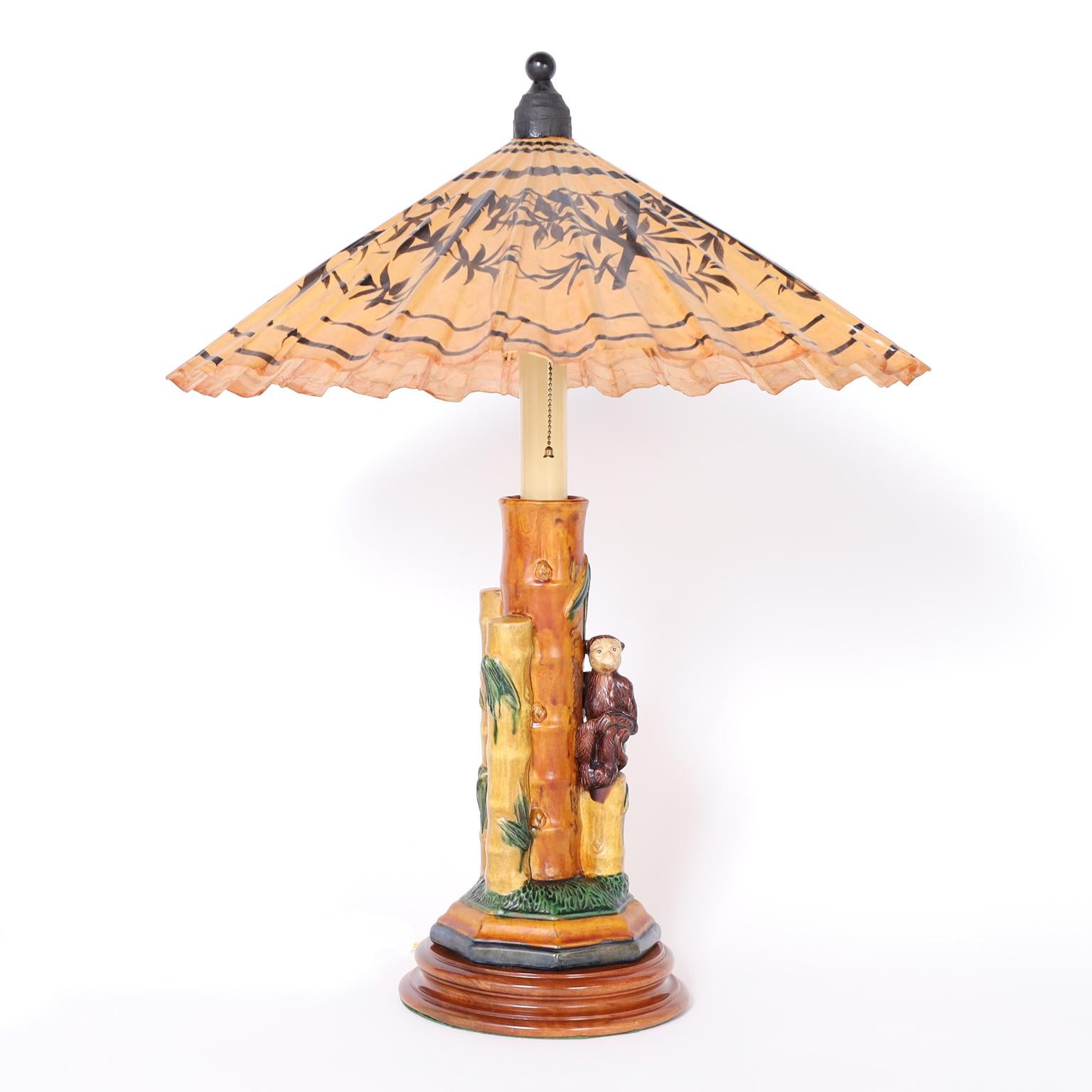 Pair of Porcelain Table Lamps with Monkeys and Umbrella Shades In Good Condition For Sale In Palm Beach, FL