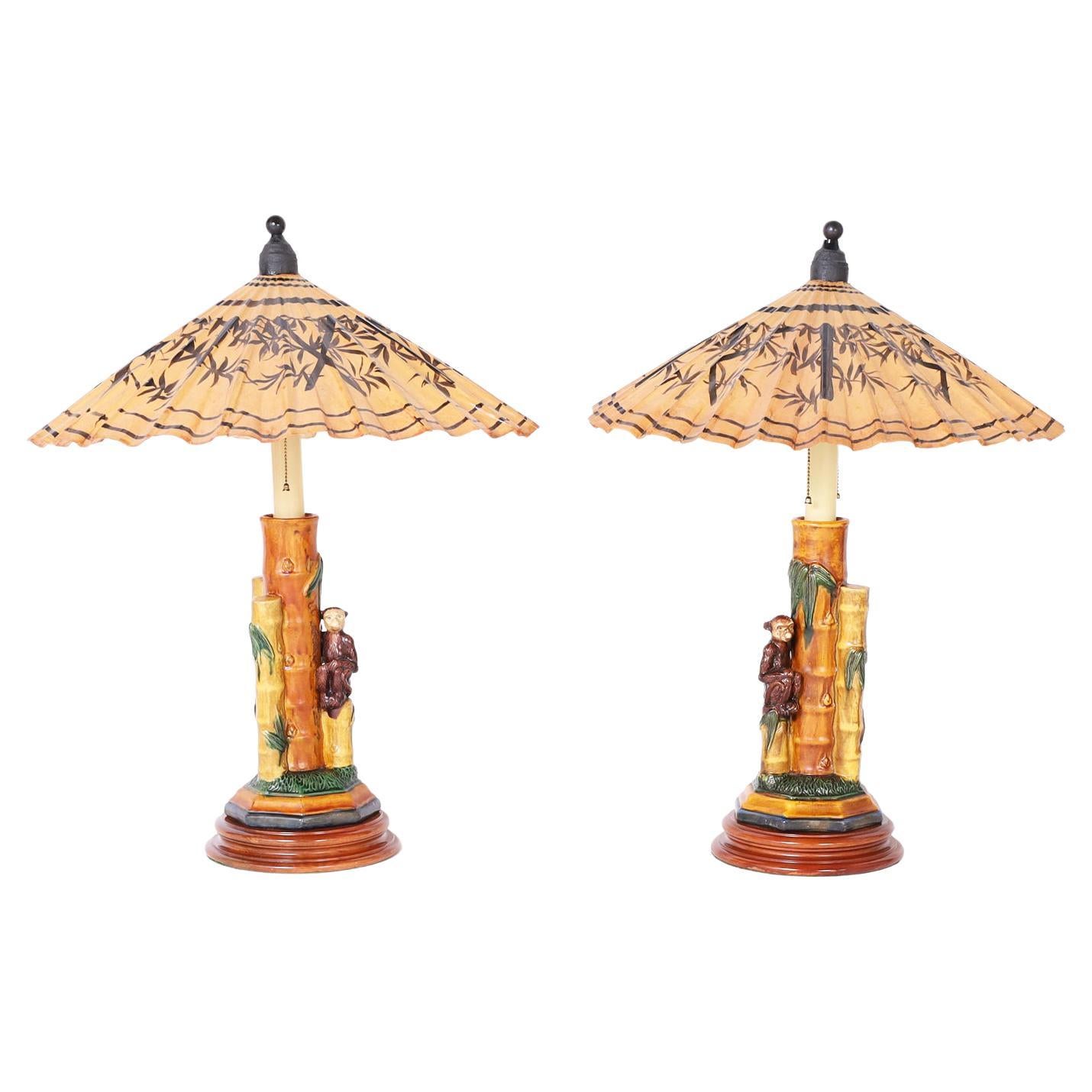 Pair of Porcelain Table Lamps with Monkeys and Umbrella Shades For Sale