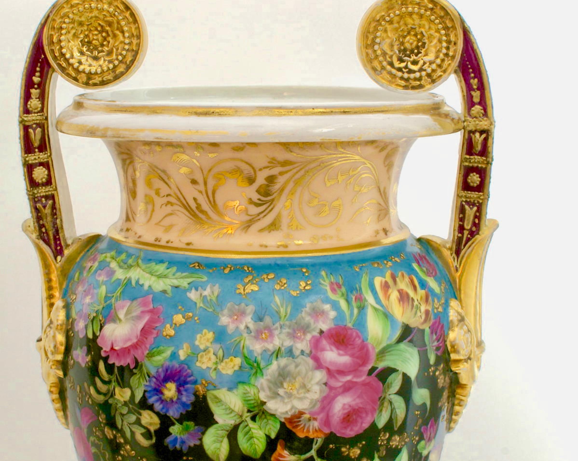 A pair of porcelain urns from the empire period, probably Russian. Painted with flowers and gilded.