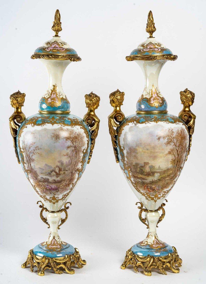 Pair of porcelain vases, late 19th century
Important pair of multi-coloured vases, with gilt and chased bronze mount, 19th century 
Marked Royal Castles of Sèvres, Paintings signed Poitevin
H: 68 cm, W: 23 cm, D: 18 cm
ref 3299.