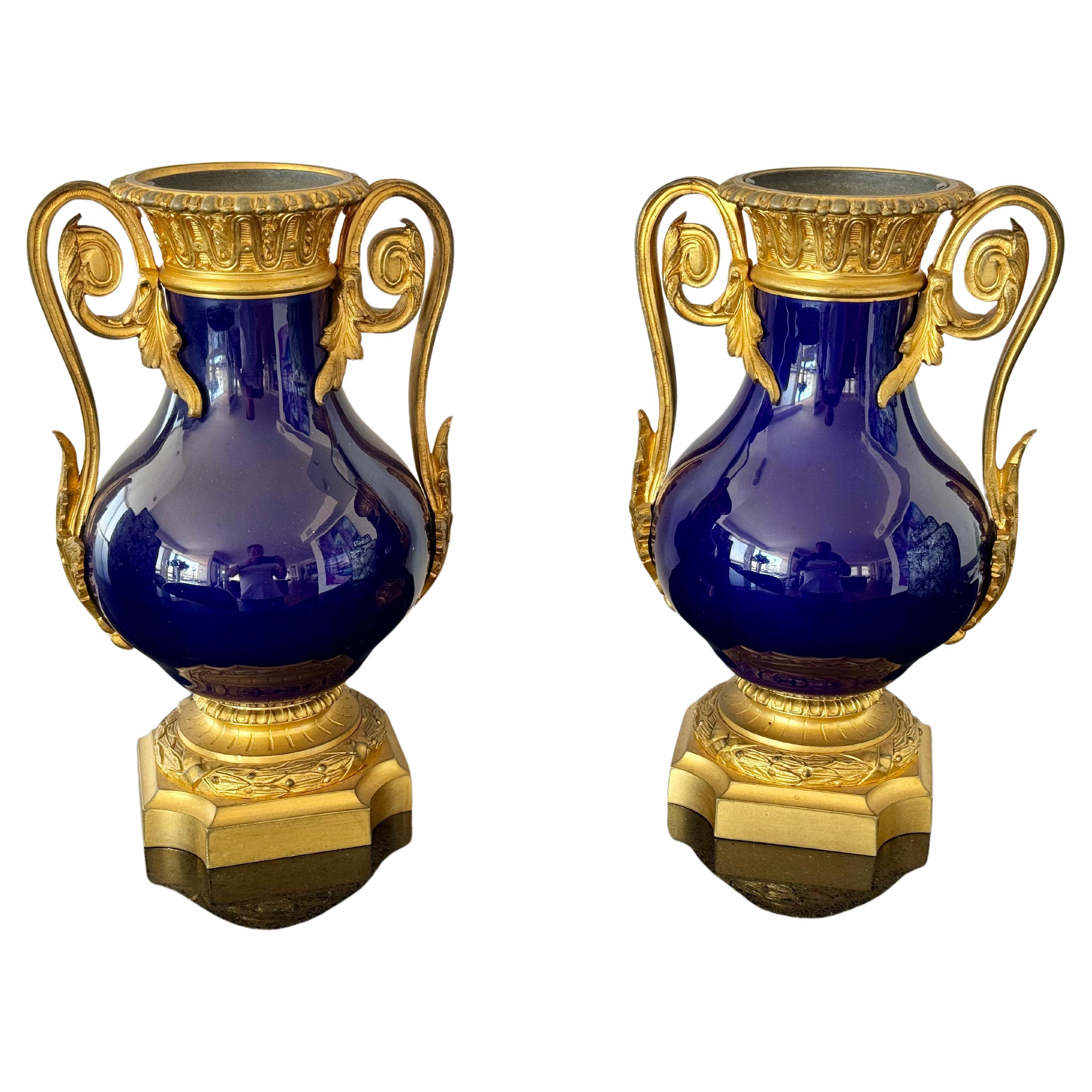 Pair of 19th Century French porcelain vases with ormolu bronze