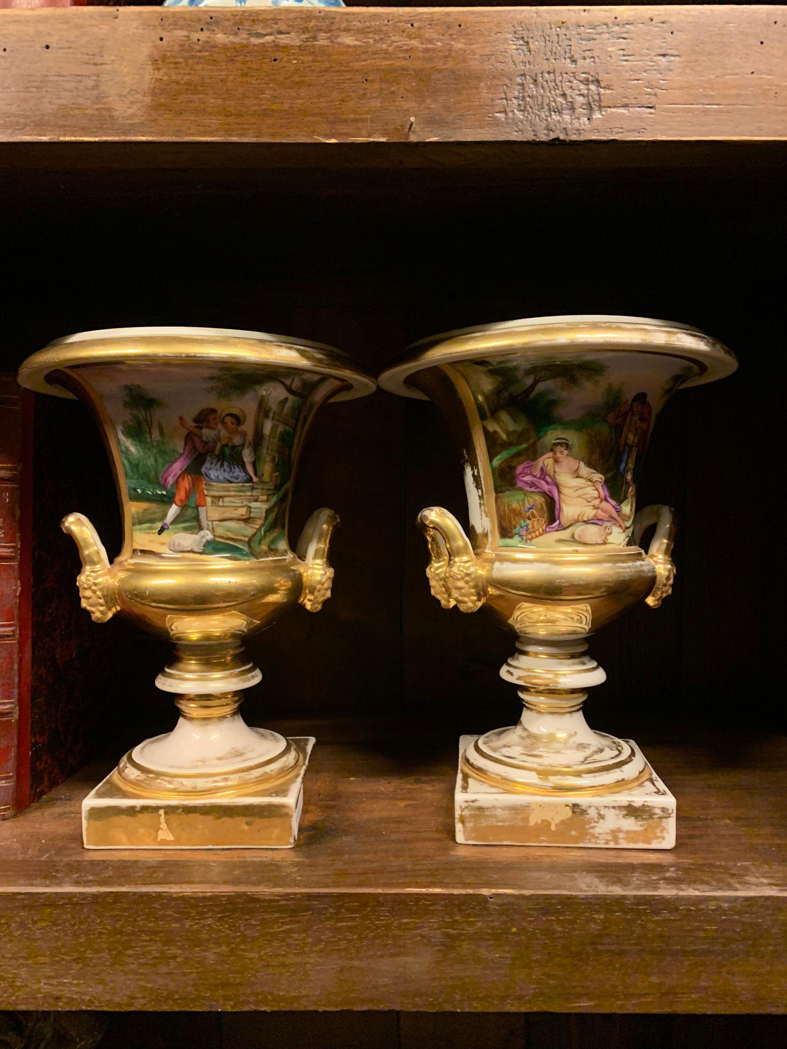 Ancient pair of fine porcelain vases, handmade and polychrome decorated with bucolic scenes and gilded edges, from Italy, 19th century, each measuring w 20 x h 29 x d 20 cm