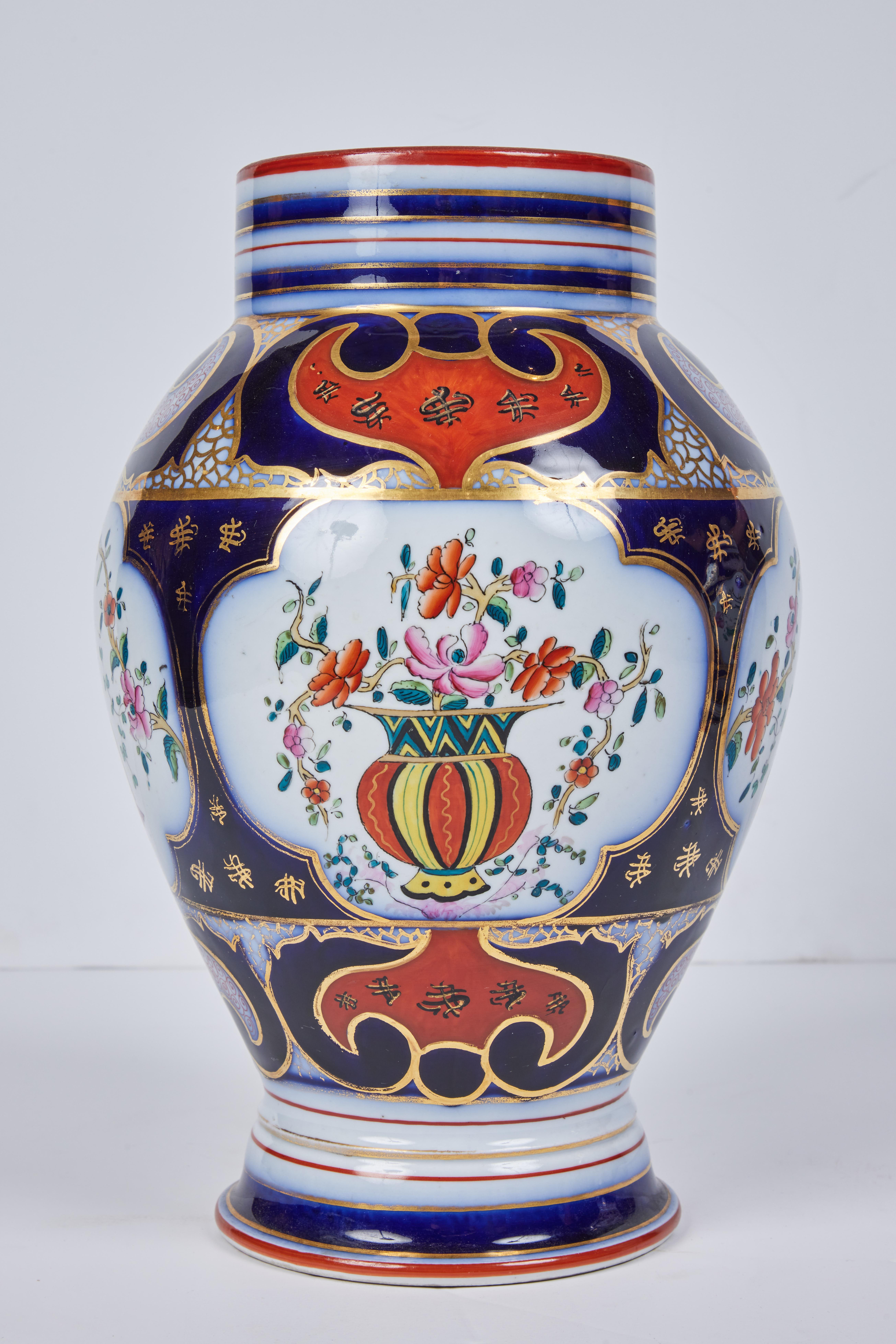 European Pair of Porcelain Vases with Gilded Detail For Sale