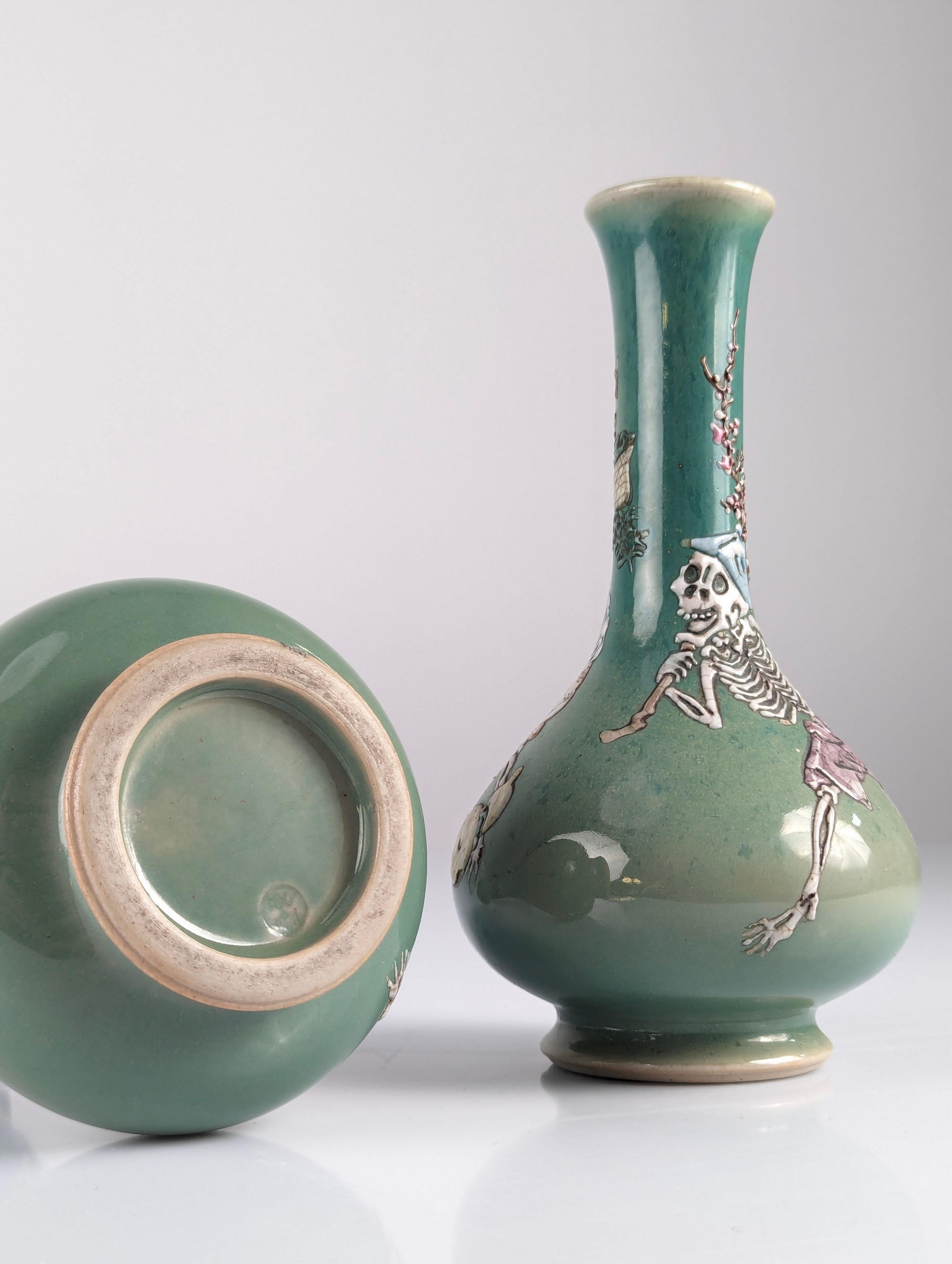 Pair of Porcelain Vases with Skeletons in Relief, Signed, Japan Era Meiji/Taisho 10