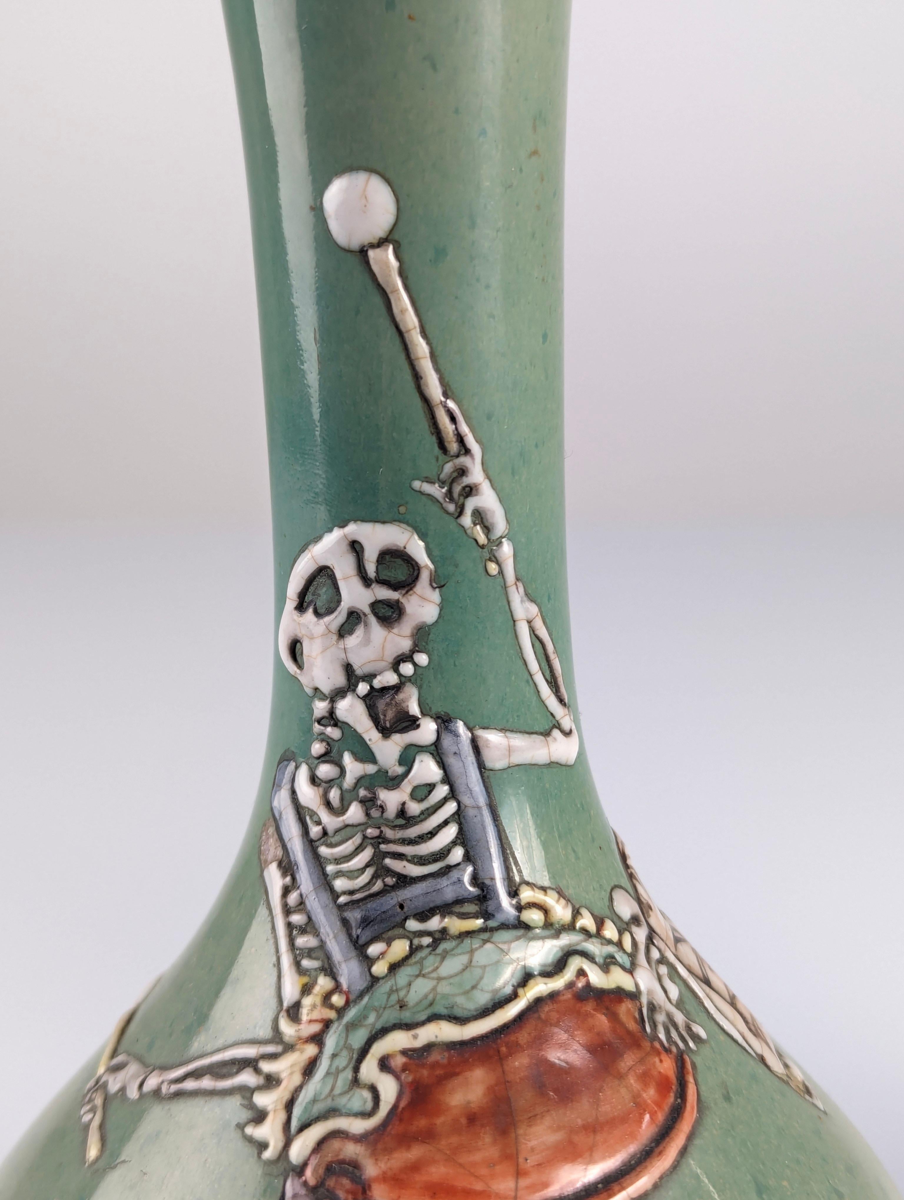 Pair of Porcelain Vases with Skeletons in Relief, Signed, Japan Era Meiji/Taisho 13