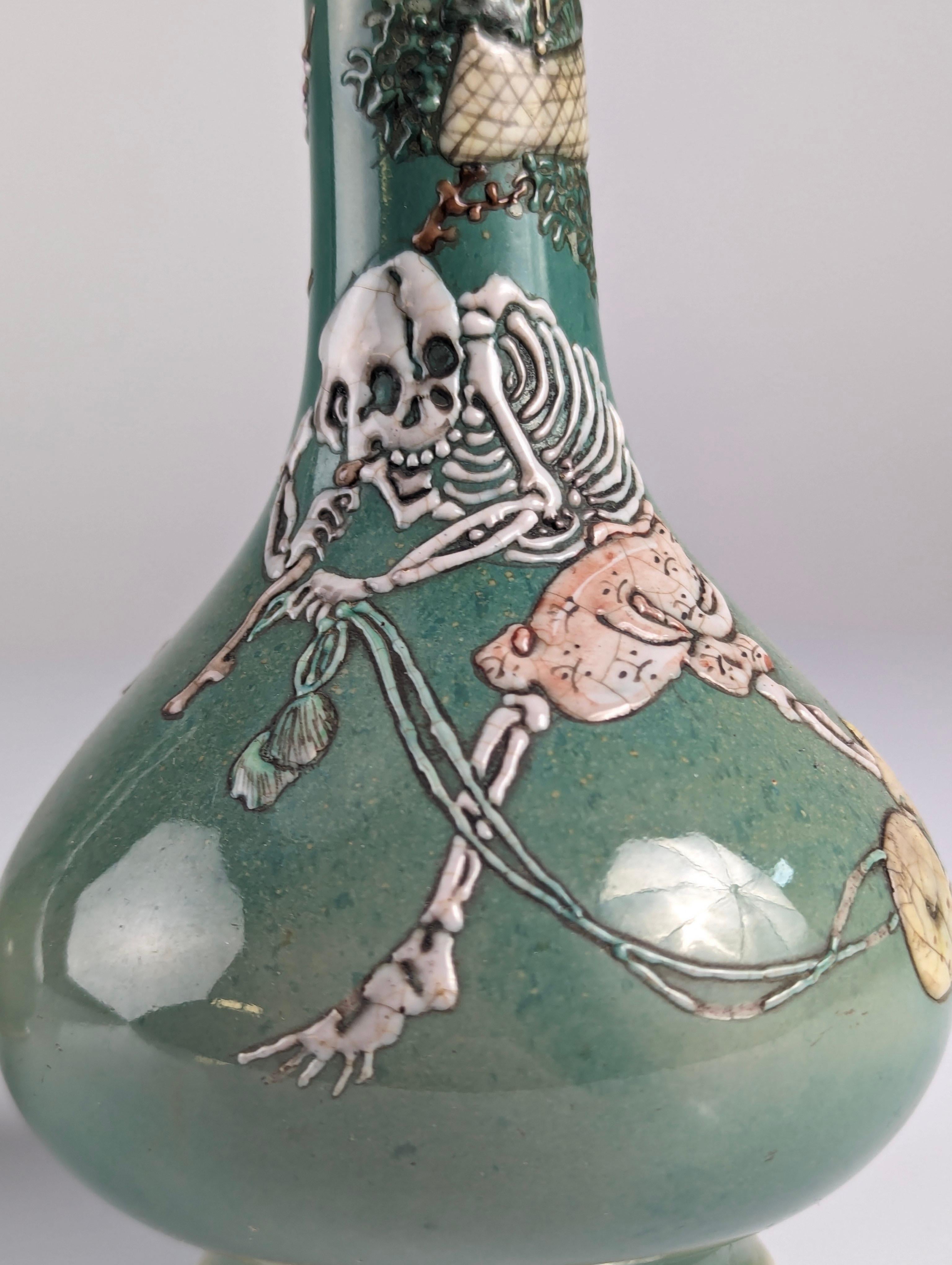 Pair of Porcelain Vases with Skeletons in Relief, Signed, Japan Era Meiji/Taisho 3