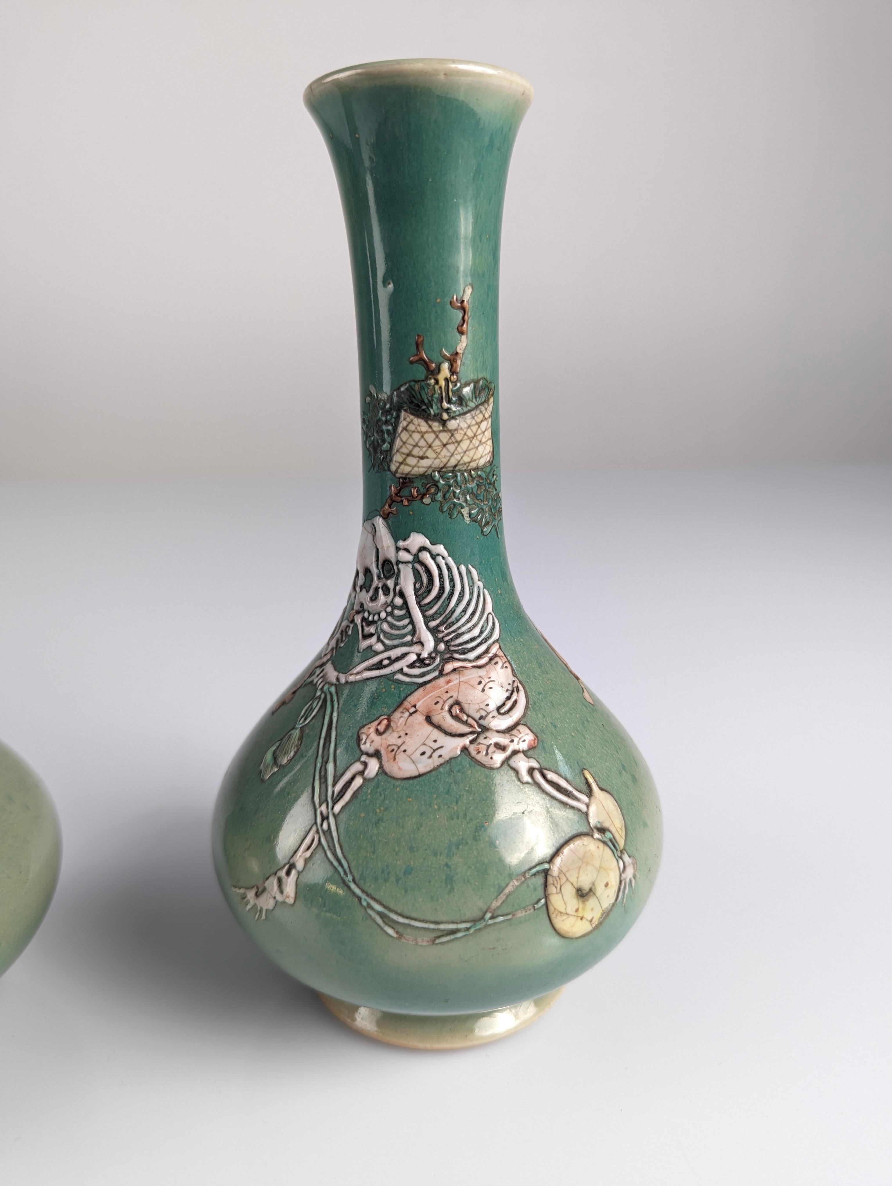 Pair of Porcelain Vases with Skeletons in Relief, Signed, Japan Era Meiji/Taisho 4
