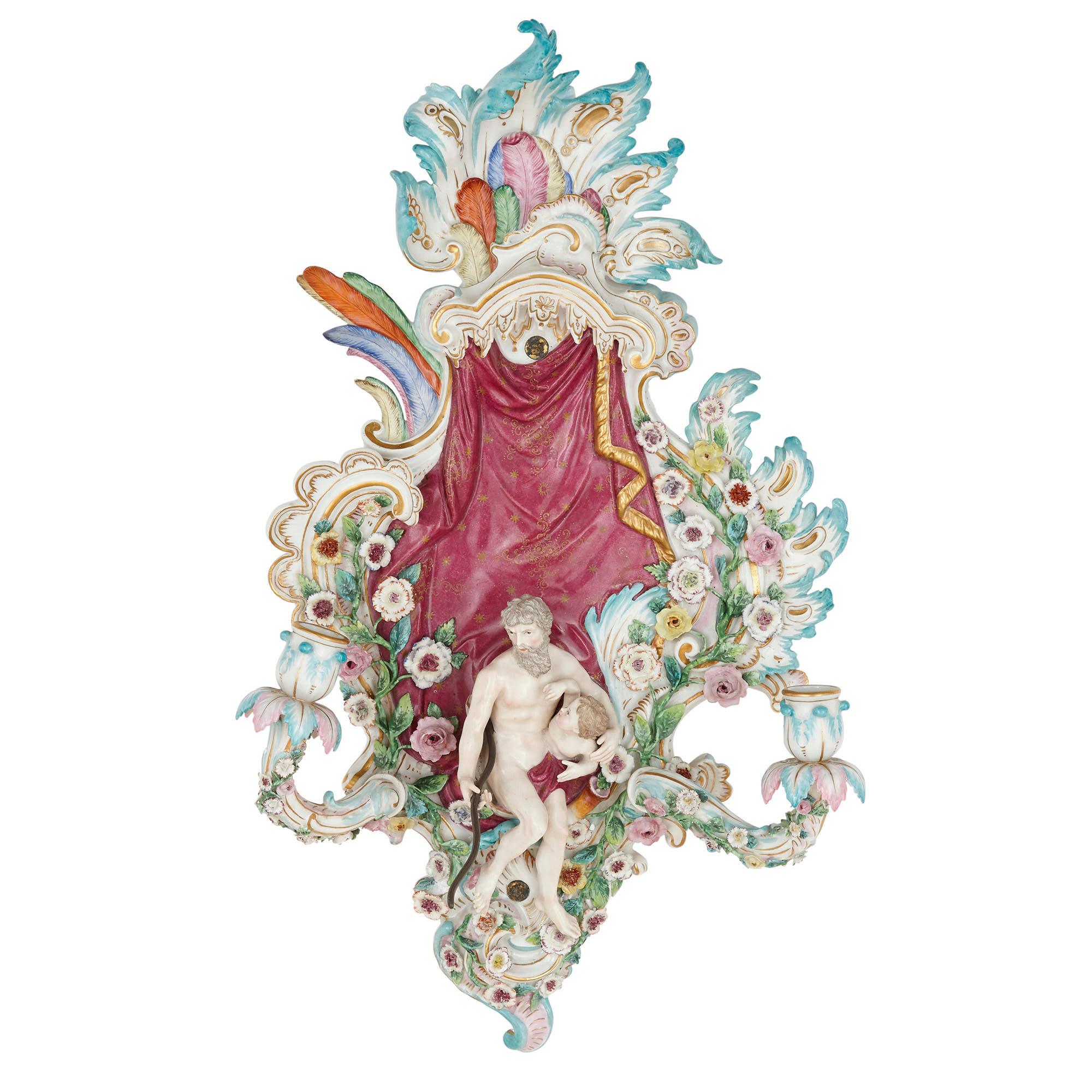 This exquisite pair of German Rococo style Meissen sconces feature beautifully encrusted porcelain flowers and petals and exceptionally finely hand painted passages. In their unmatched quality, the pair epitomises the very best of the Meissen