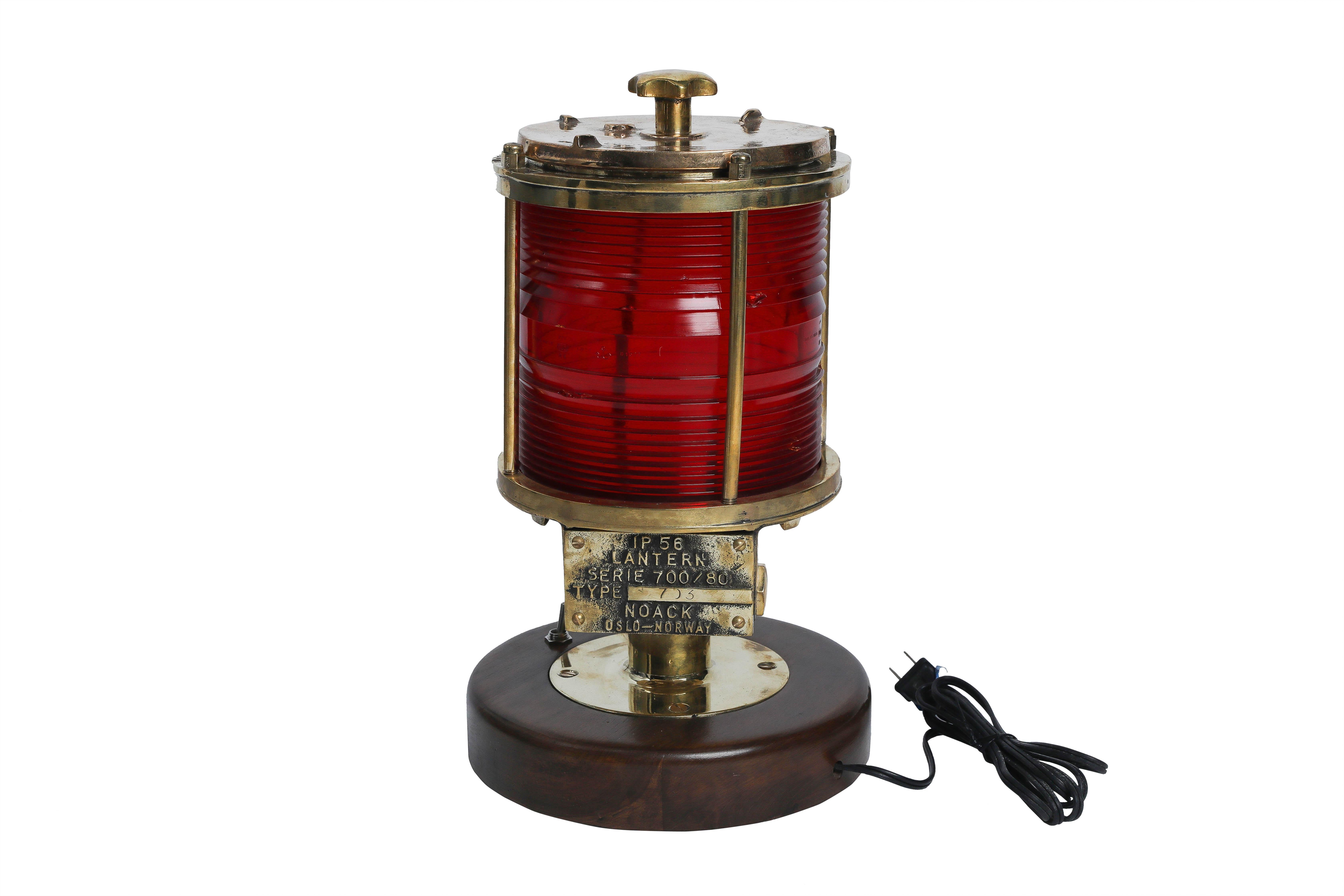 Pair of brass port and starboard post lights from a decommissioned ship. Full round, Fresnel lens glass shades. They've been mounted on a teak round base which is 9