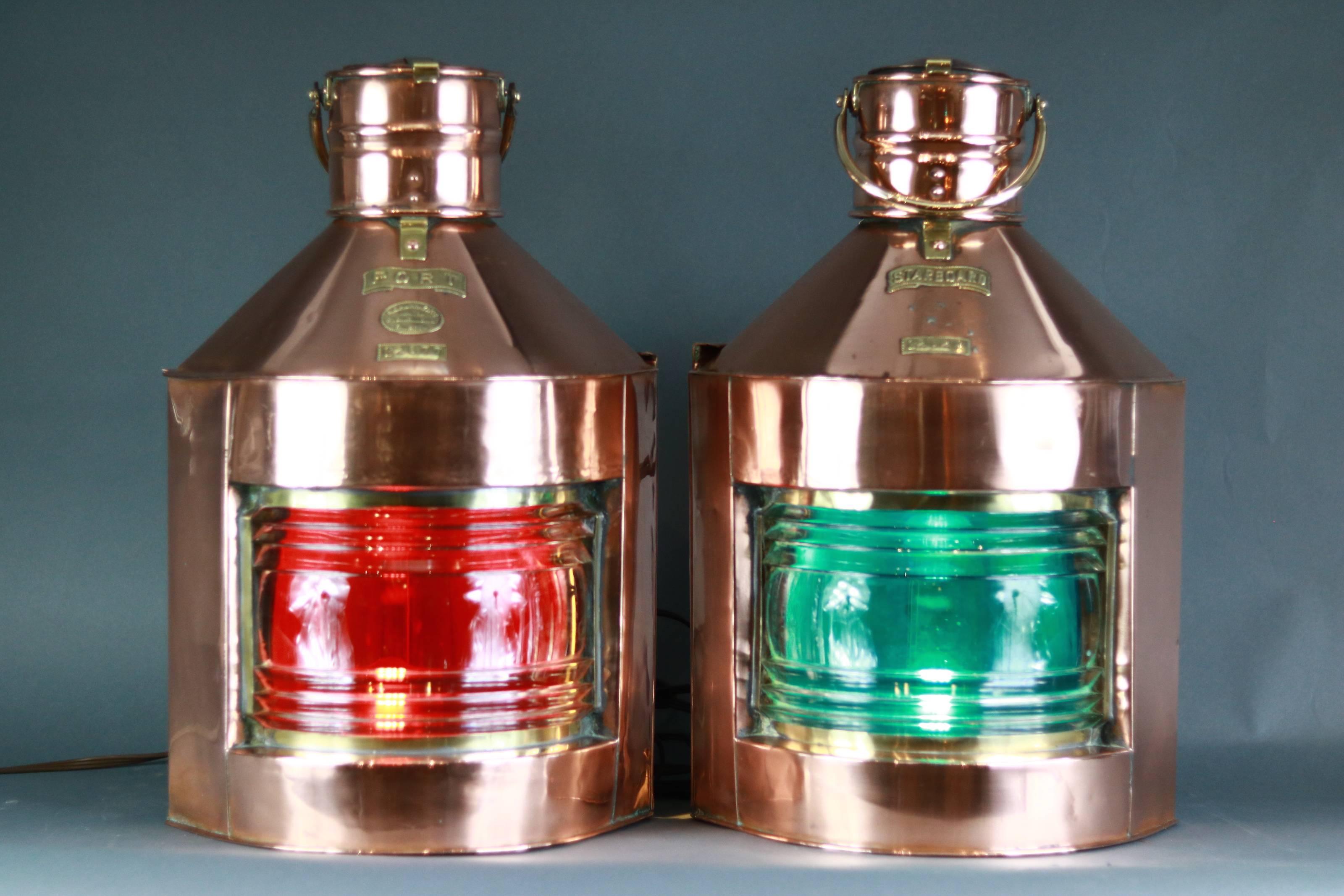 Authentic pair of ship's copper port and starboard lanterns. Lanterns have clear Fresnel lenses with red and green filters. The lights have been electrified. Rear door slides up, corner back, brass handles and badges. Measures: 24
