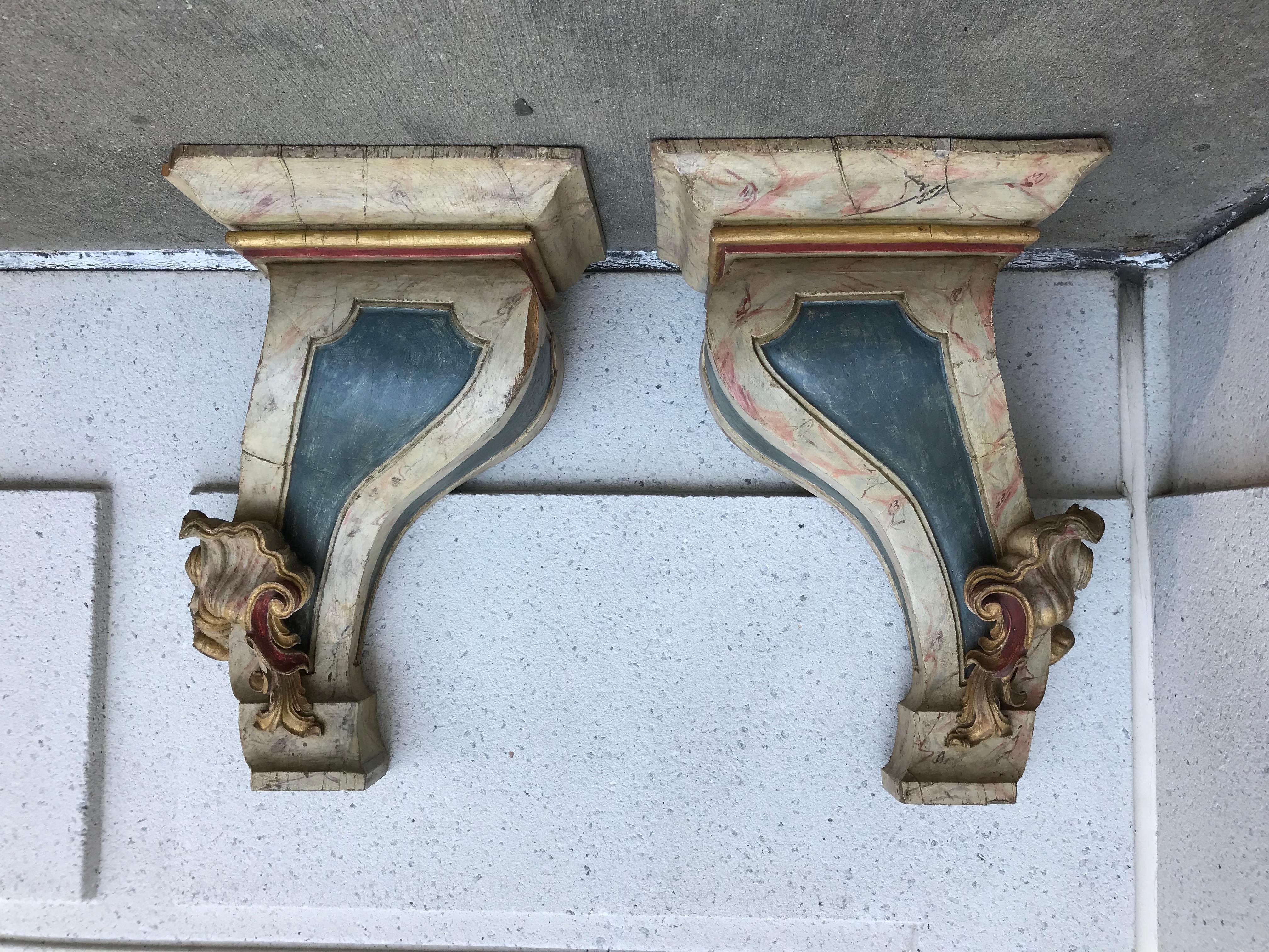 Pair of handsome and impressive large-scale 19th century Portuguese Baroque hardwood faux marble painted and gilt wall brackets. These are possibly Portuguese Colonial from Brazil, they are carved of a heavy tropical wood. They are being sold 'as