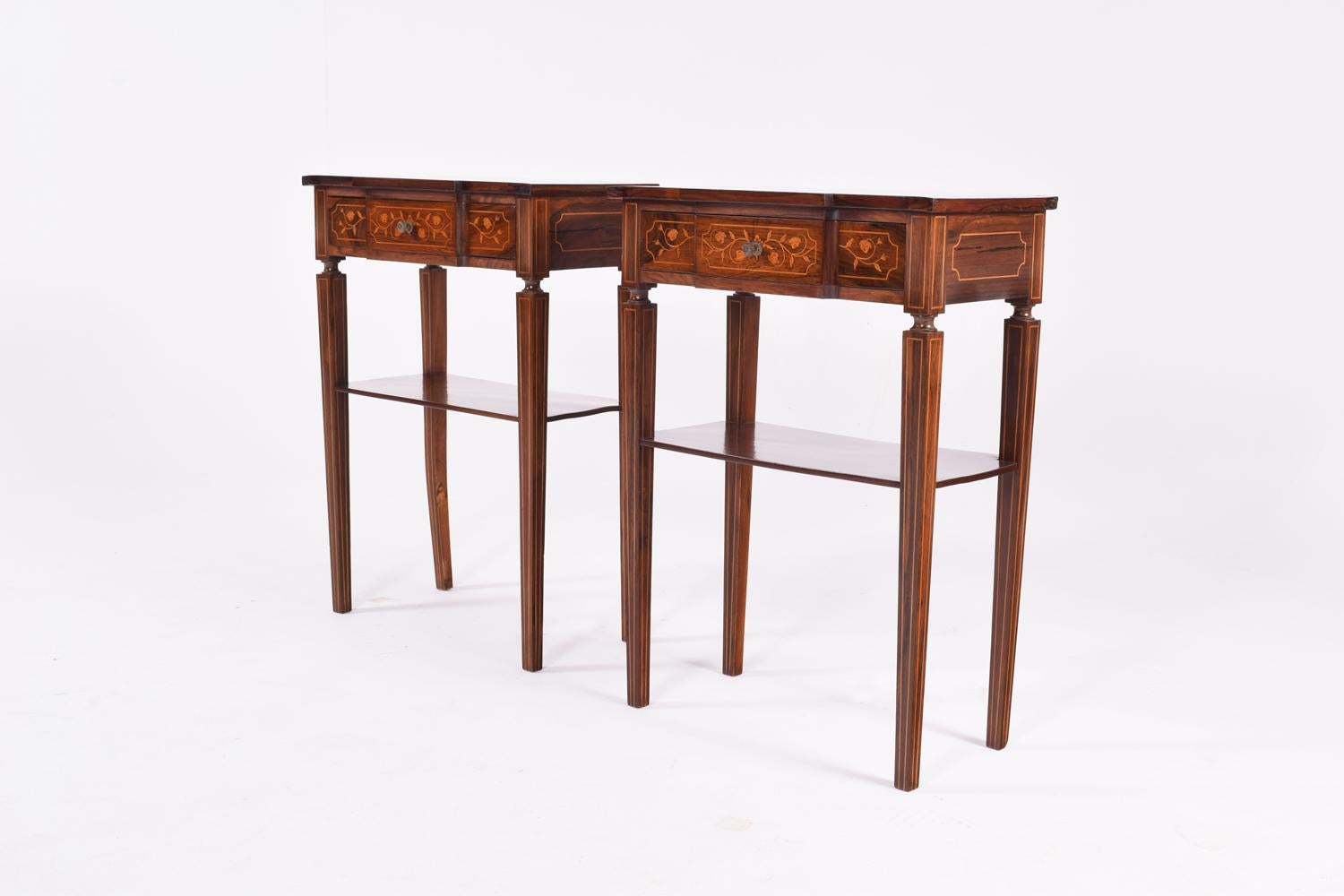 Pair of D. Maria bedside tables, Portuguese. Folded and clad with rosewood. Rich decoration in inlays with floral motifs. Drawer and shelf. Brass handles.
