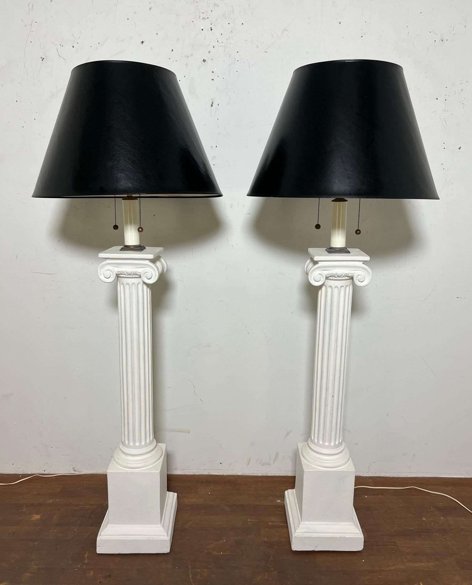 A pair of sculptural plaster floor lamps by Bob Graham ca. 1980s. These are of adjustable height, with the original black lacquer shades.

64.5
