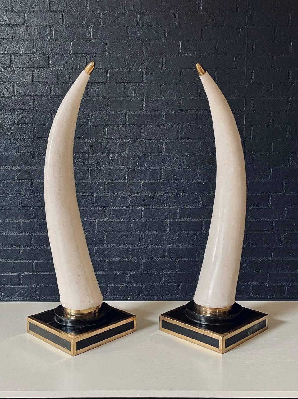 Condition: Original Vintage Condition 

Designer: Marquis Collection
Manufacturer: Marquis Collection
Materials: Tessellated Marble, Black Marble, Brass Trim

Striking and sculptural, this pair of faux tusks by the Marquis Collection of Beverly