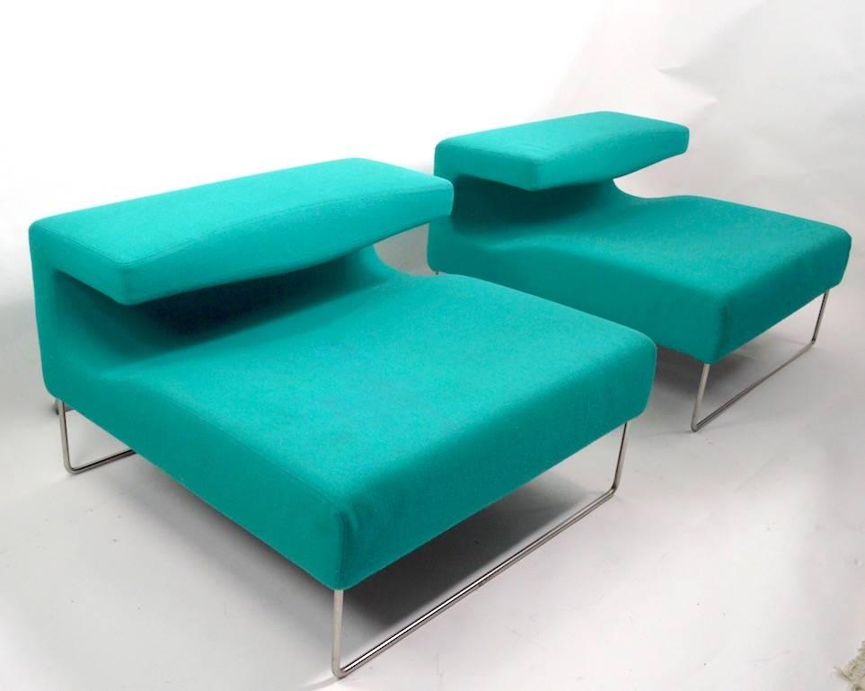 Very stylish low lounge chairs, probably Italian production, circa 1970s-1980s. Formed upholstery on tubular chrome legs, Fabric shows some cosmetic wear, minor discoloration and spots, normal and consistent with age. Measures: Seat H 15 inches.