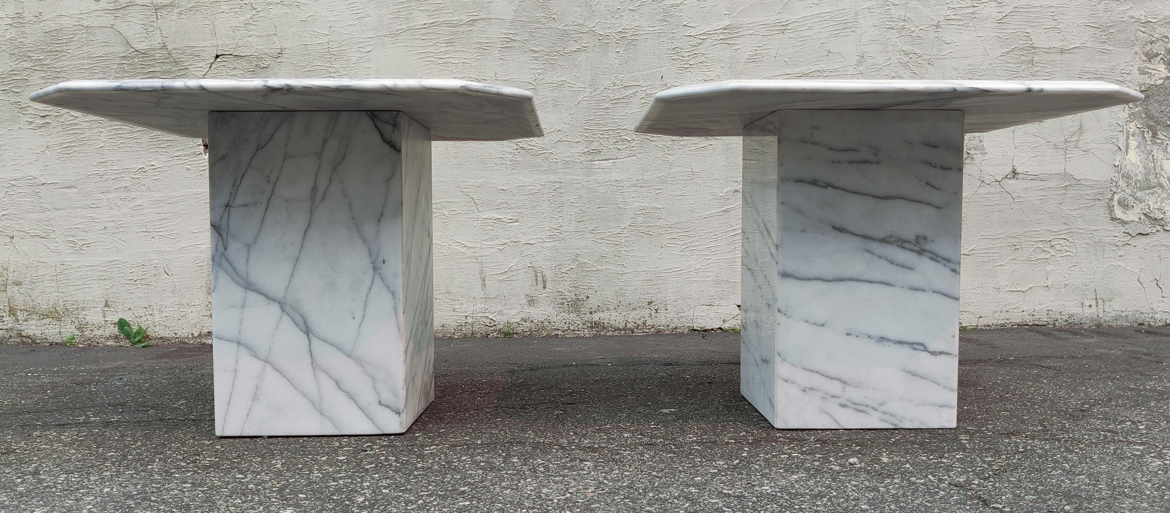 This gorgeous pair of marble side tables were designed in the manner of Stone International and made in the 1970s in Italy. Made of a beautiful white marble with smooth grey and black veining throughout, these tables feature no yellowing at all,
