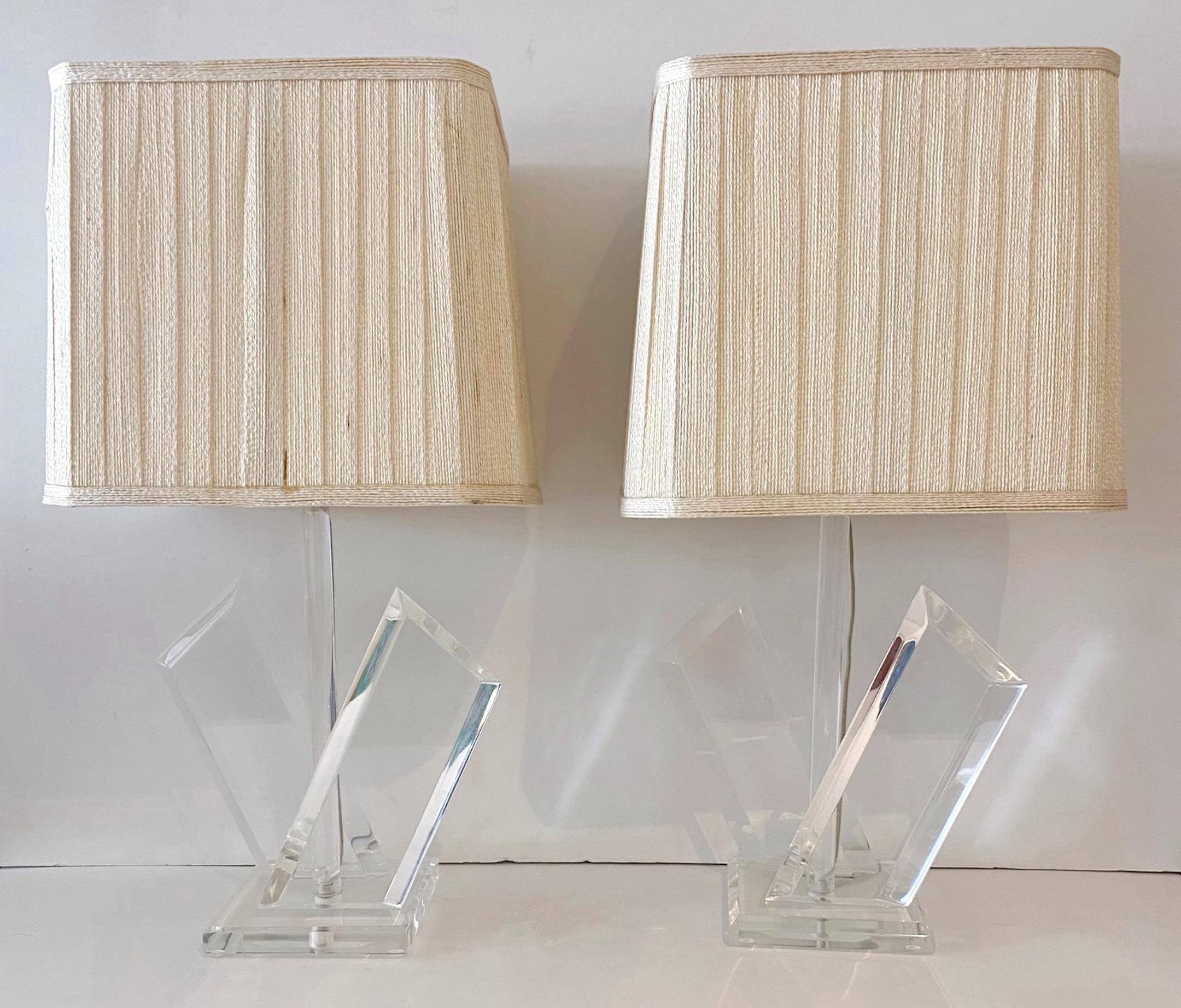 Pair of Post Modern Lucite Twin Column Lamps 
USA, Circa 1980s

Each one with two angled beveled columns raised on a rectangular base. 
New wiring, Ready for shades of your choice 

Overall measurements: 
 
7-Inch square base 
13-inches