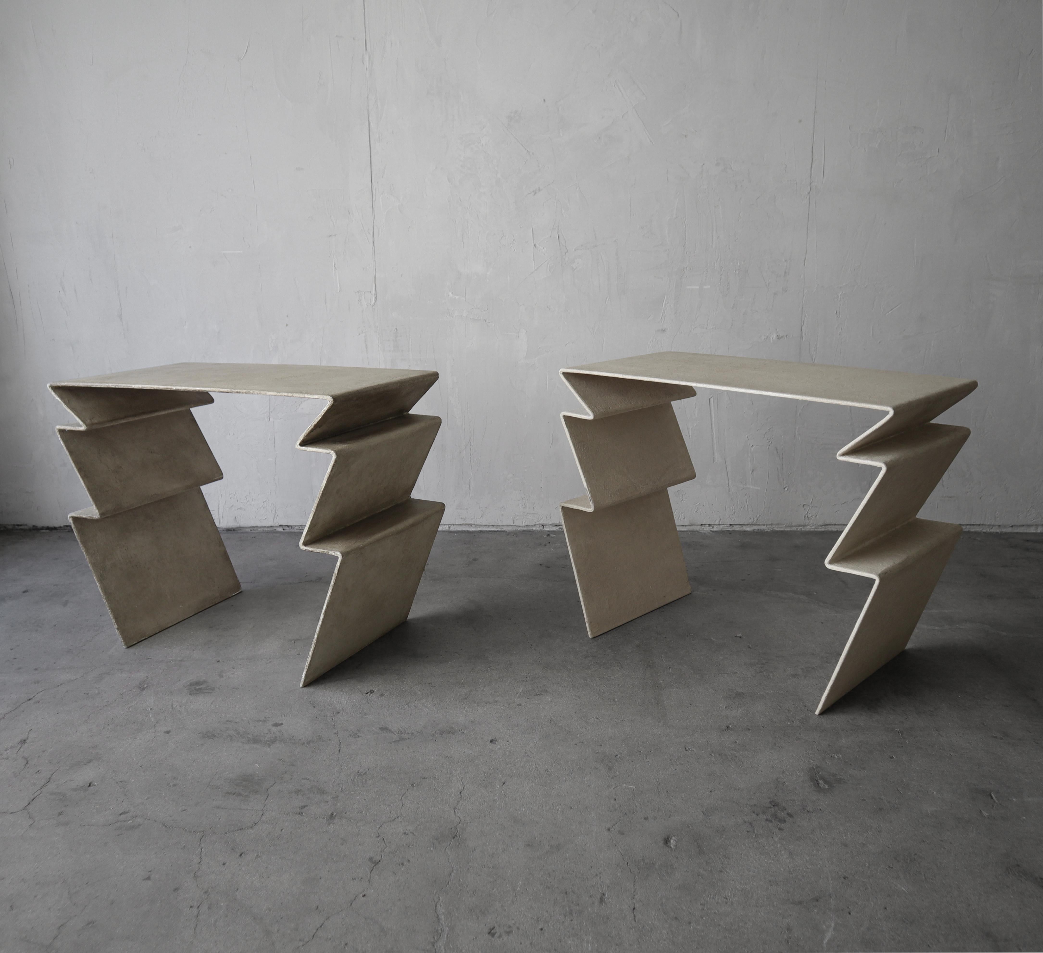 This is a super unique pair of large Post Modern side tables.  They are constructed out of bent metal and covered in grass cloth and plaster.  They are real pieces of art.  They came from a multimillion dollar estate of a famous artist and art