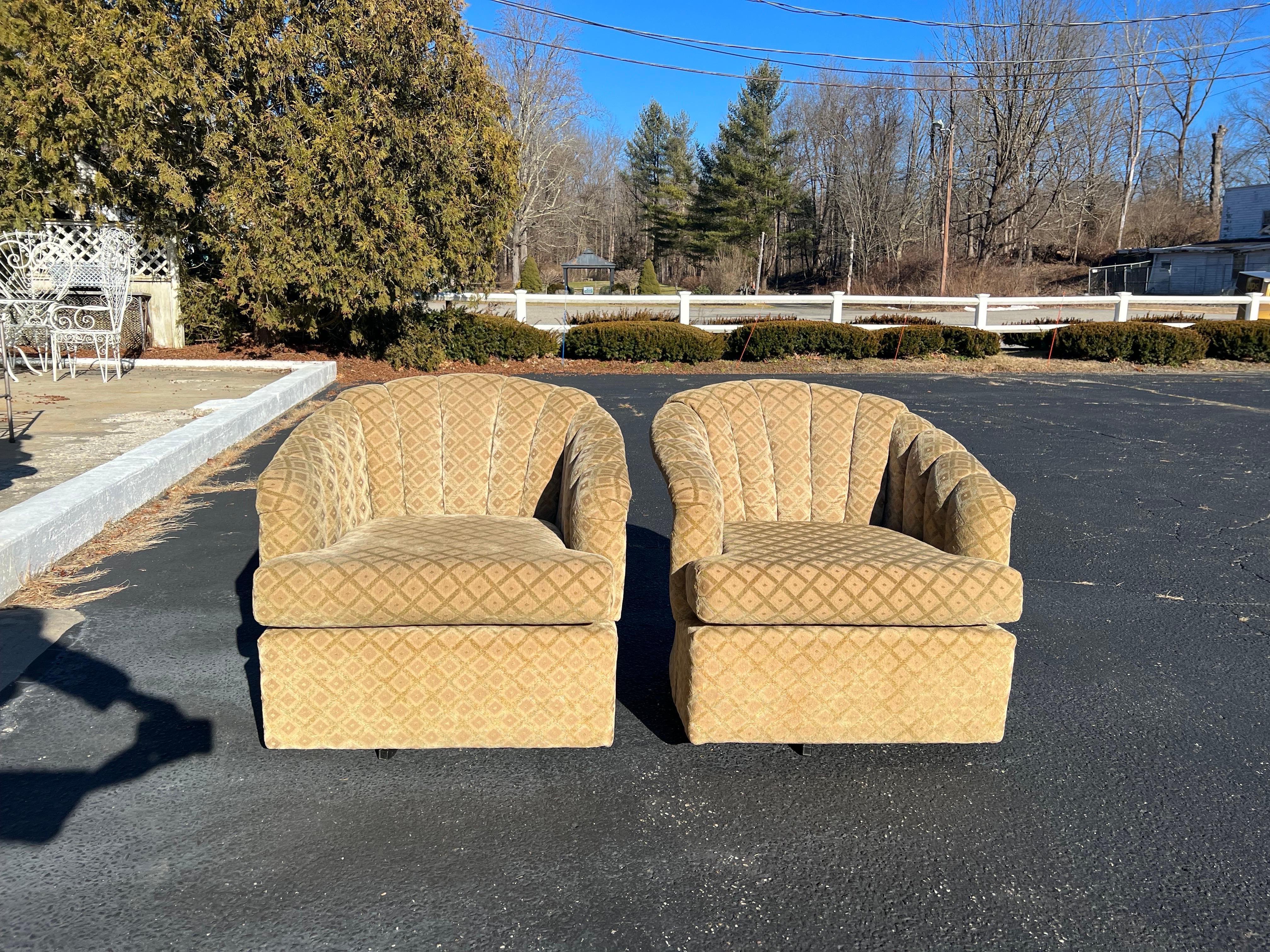 Pair of Post Modern Swivel Chairs. Nice channel back design for comfort. Rich velvet feel to this upholstery in golden tan and sage green tone. Classic cube barrel back design for comfort . 