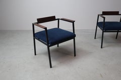 Pair of Postmodern armchairs in steel and mahogany, 1970s