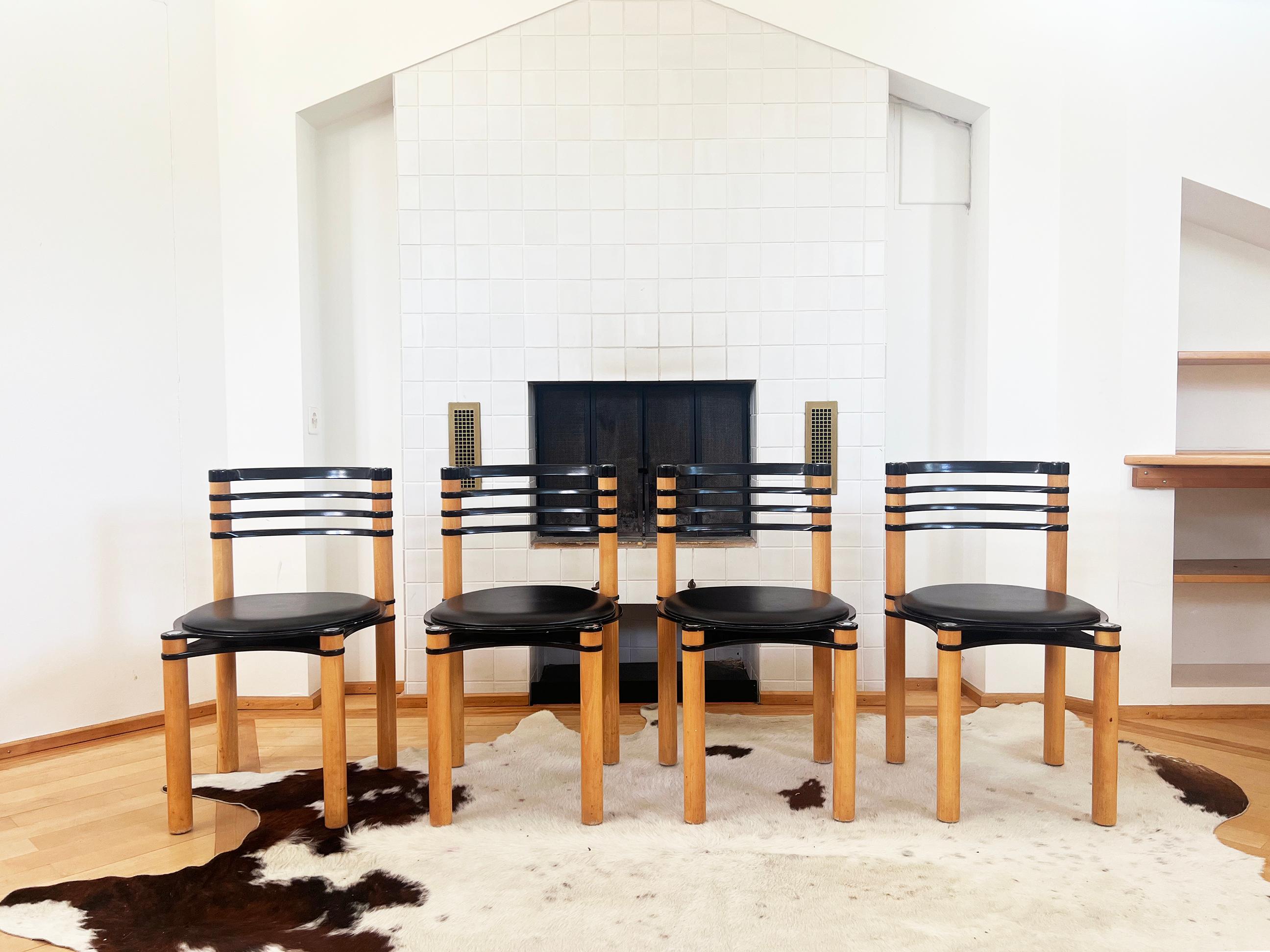 Gorgeous pair of Postmodern Memphis 80s chairs by Kurt Thut for Dietiker. NOTE: We have two sets available, sold in pairs here. Listed as a set of 4 in a separate listing here.  

The chair features a unique combination of materials, with a wooden