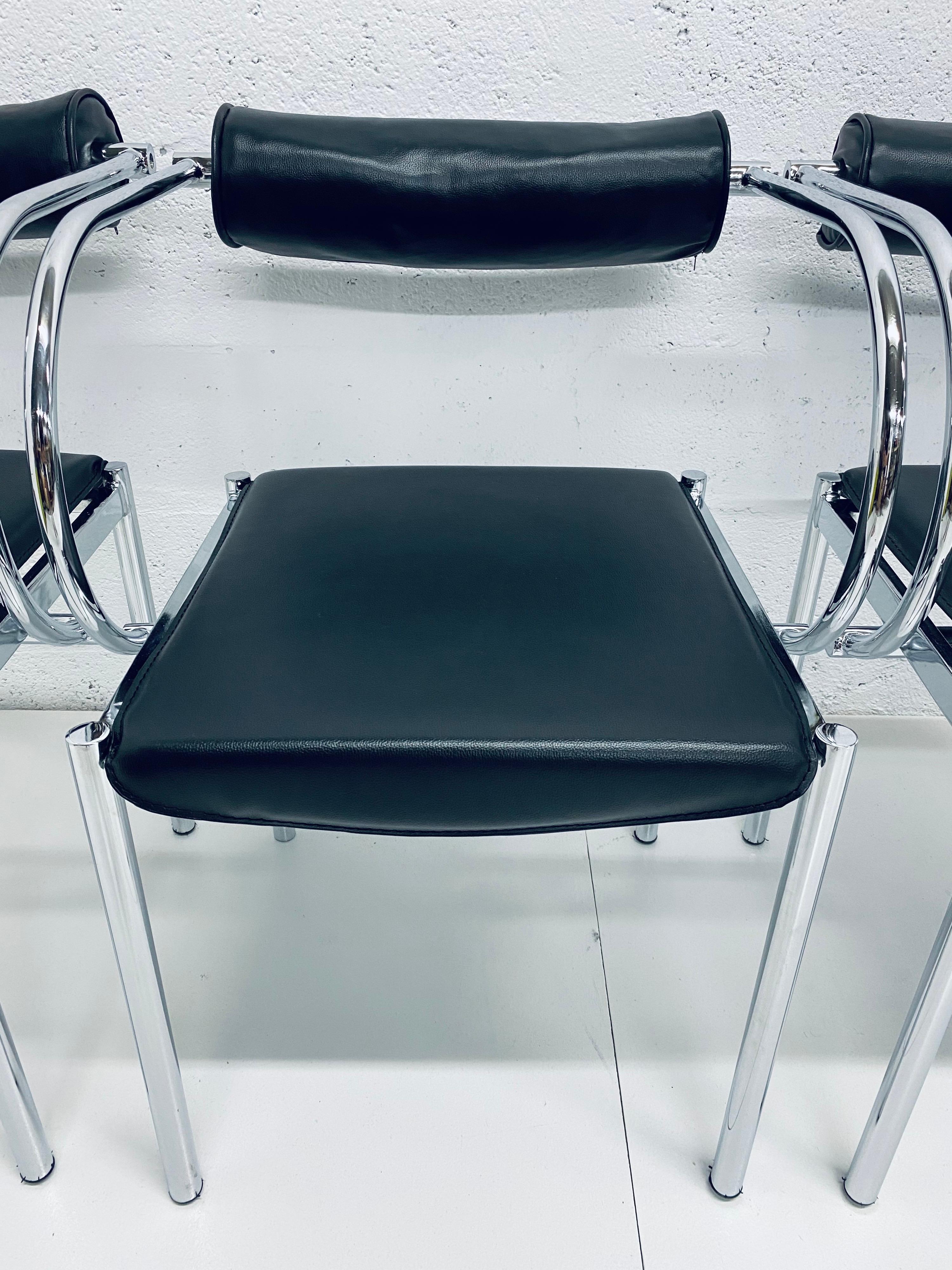 Postmodern design chairs with black Naugahyde seat and foam back on a polished chrome tubular frame. Manufacturer unknown.