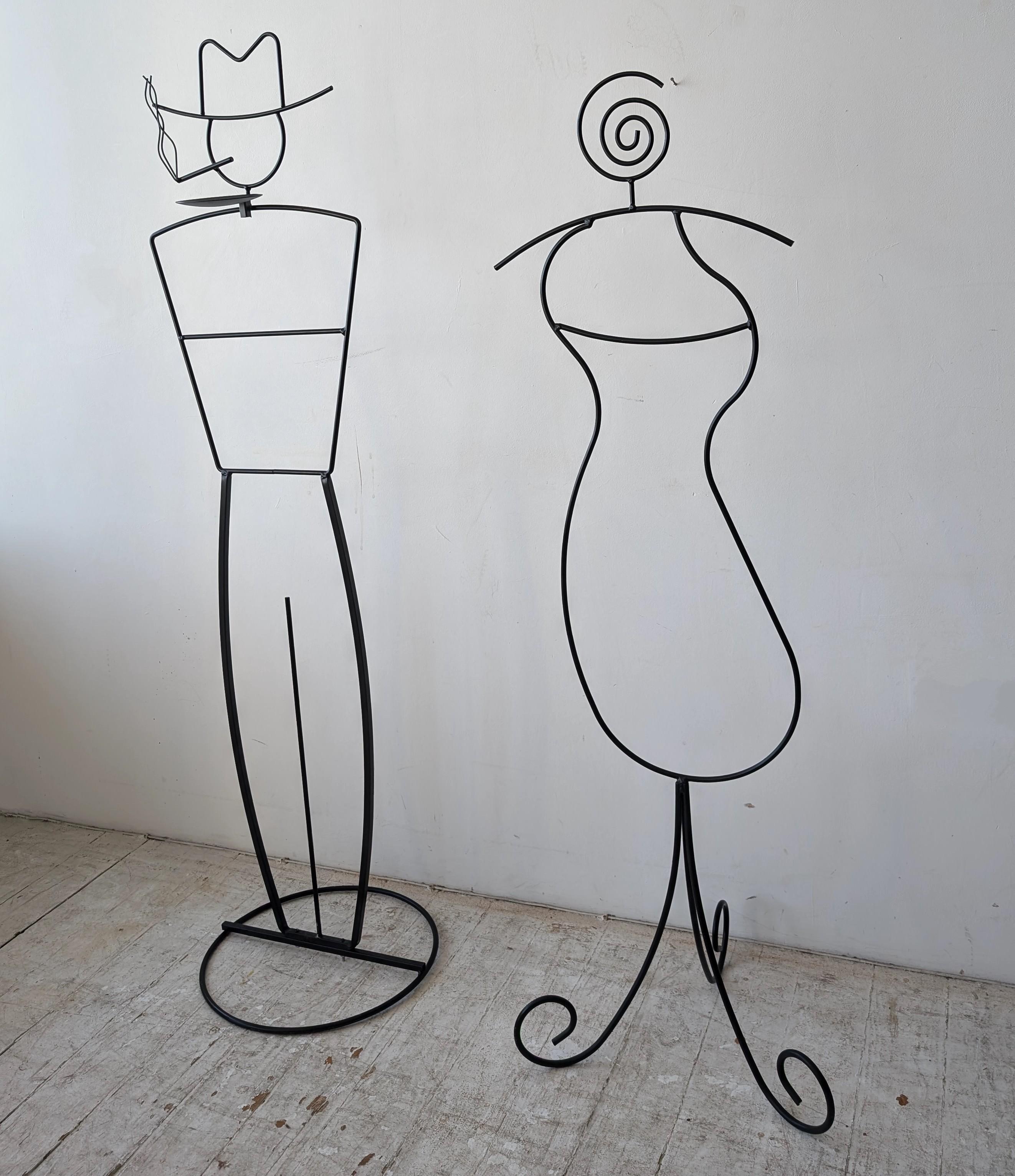 American Pair of postmodern John Risley style black metal figural valet stands, USA 1980s